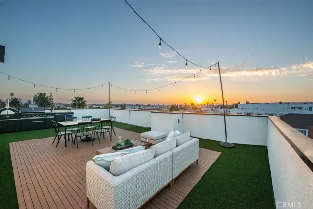 a view of a terrace with couches and potted plants