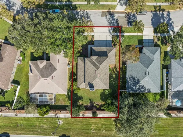 an aerial view of houses with yard