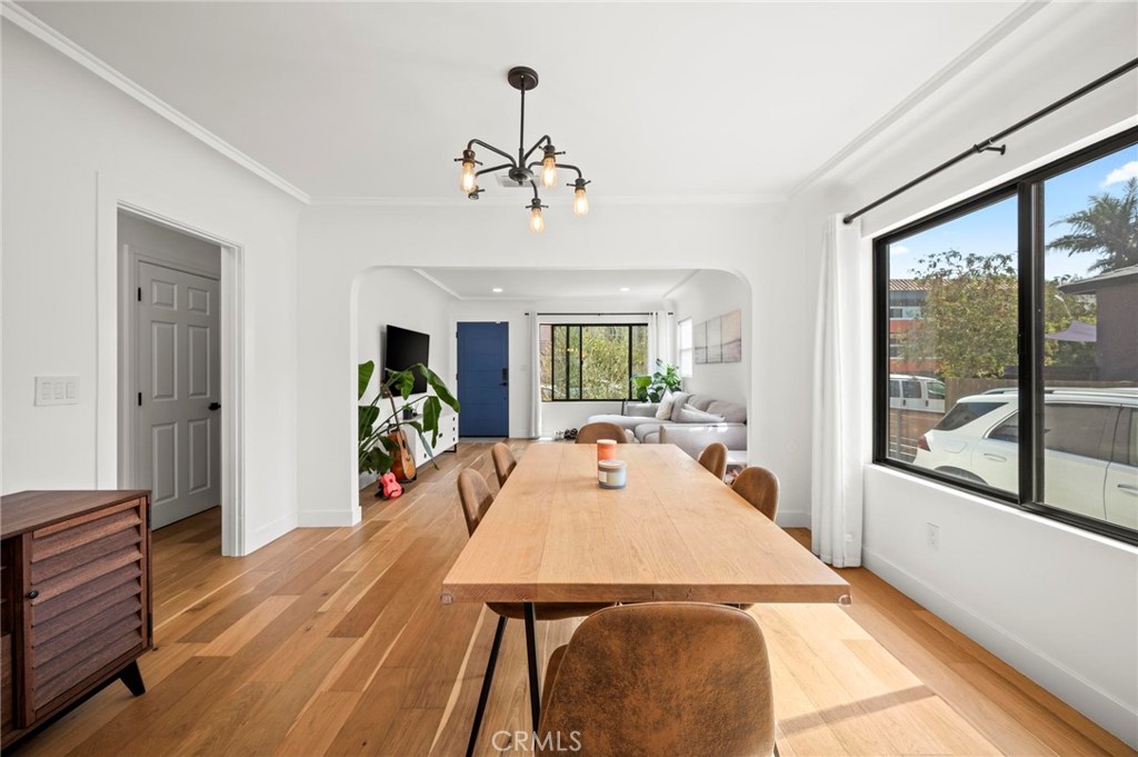 3345 Oakhurst Avenue Los Angeles, CA 90034 - Photo 20 of 49 a view of a dining room with furniture window and wooden floor