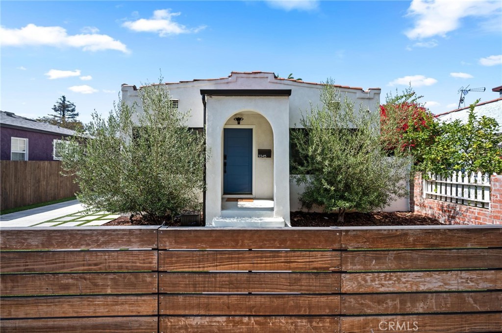 3345 Oakhurst Avenue Los Angeles, CA 90034 - Photo 37 of 49 a view of a house with a window and wooden floor