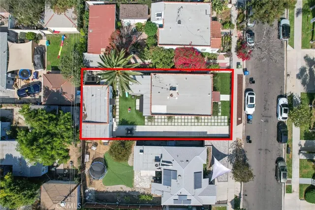 an aerial view of residential house with parking