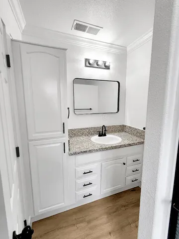 a view of a house with a backyard and a patio