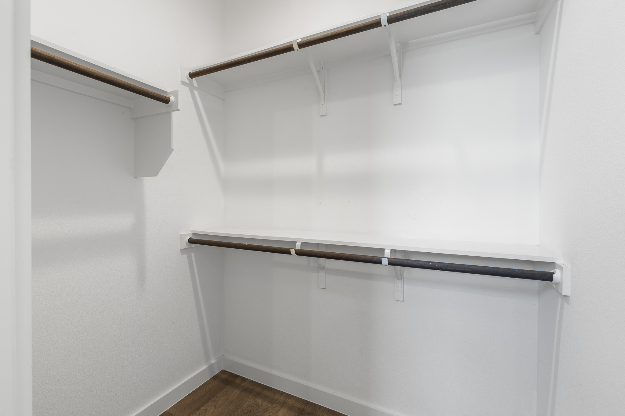 2604 Wheless Lane, Unit 1 Austin, TX 78723 - Photo 23 of 38 Built-in shelving and rods maximize storage in this well-organized walk-in closet.