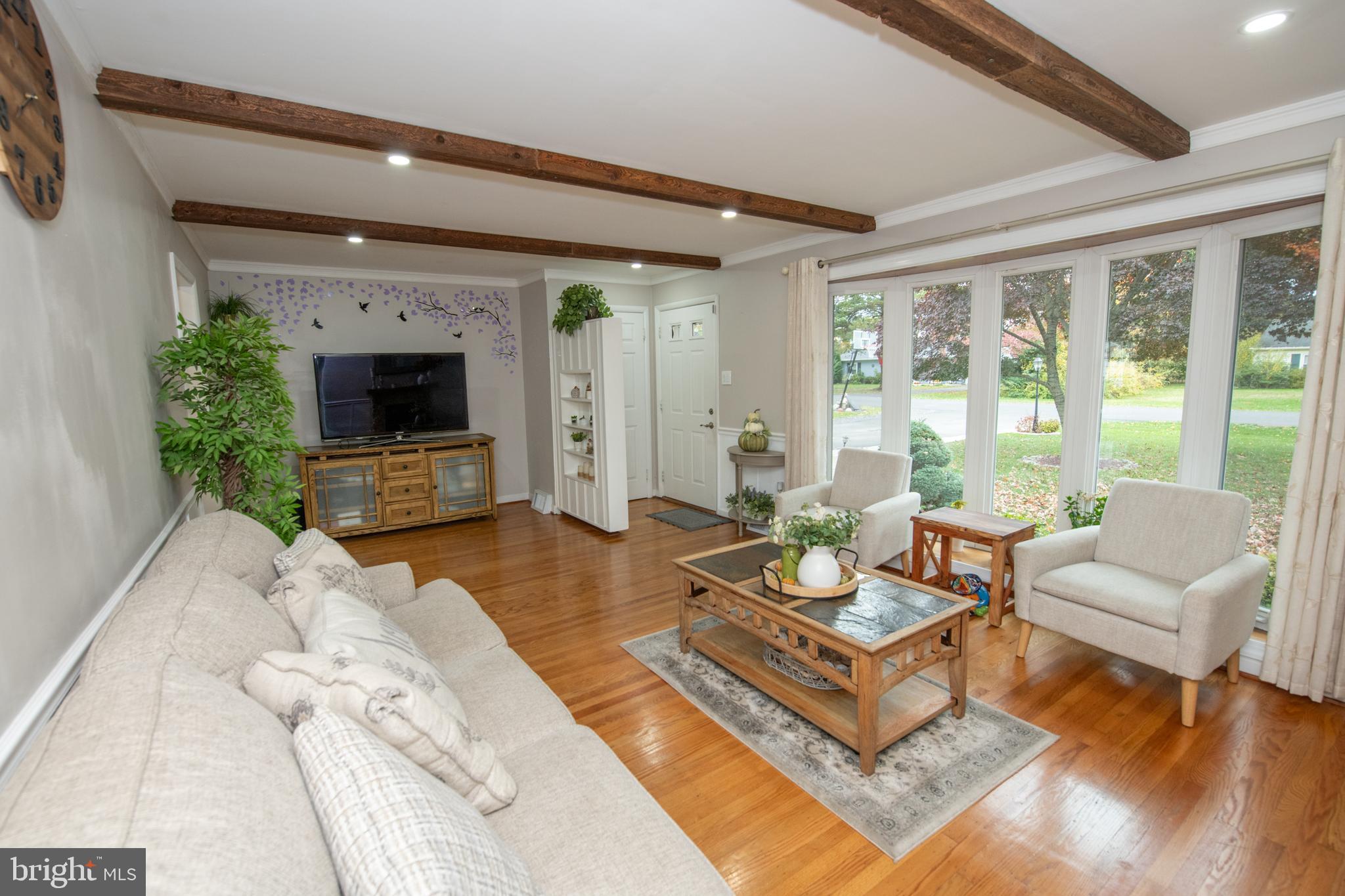 1309 Clyde Road Warminster, PA 18974 - Photo 12 of 39 a living room with furniture large window and a fireplace