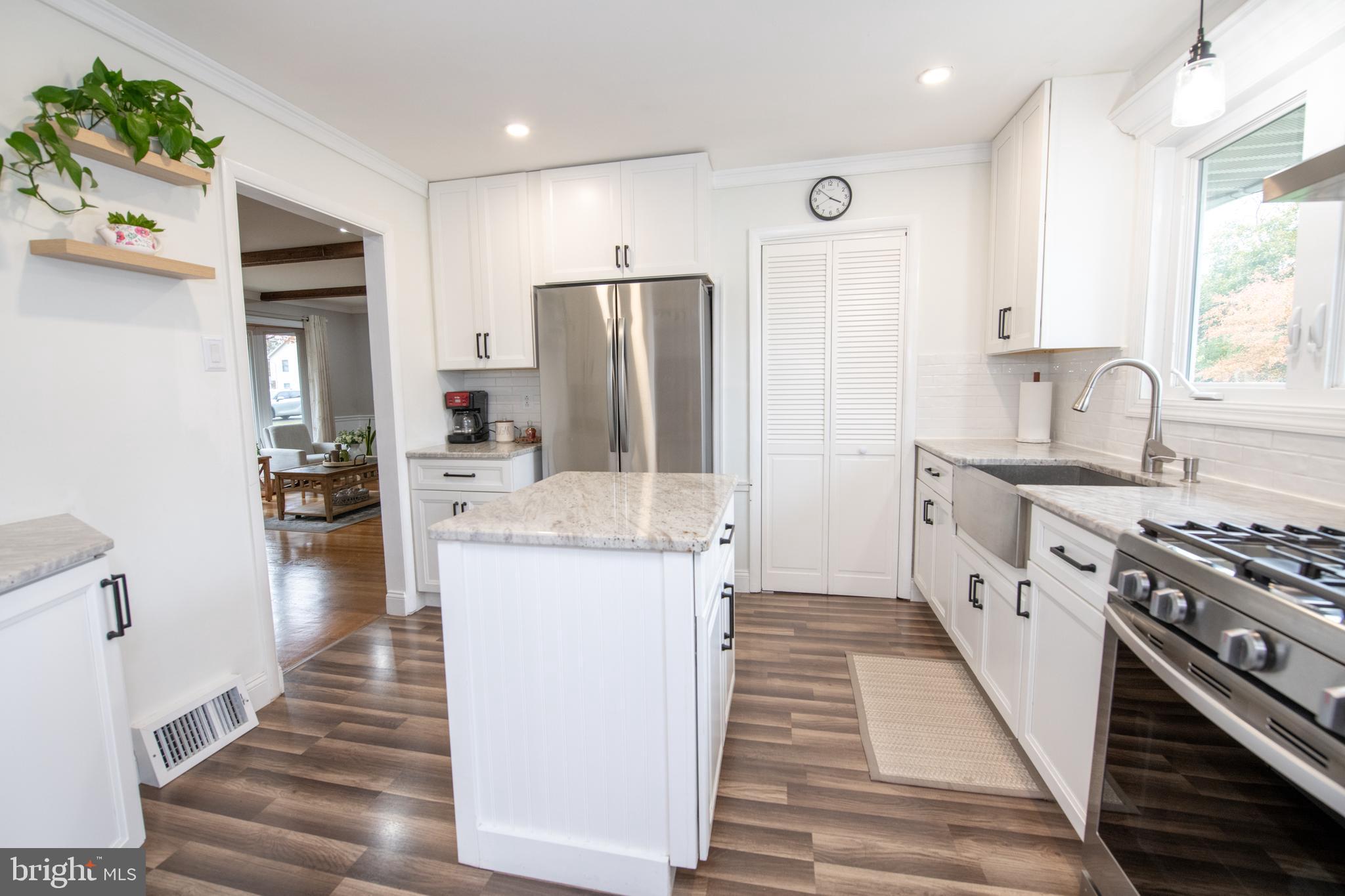 1309 Clyde Road Warminster, PA 18974 - Photo 13 of 39 a kitchen with stainless steel appliances a stove a sink and a refrigerator