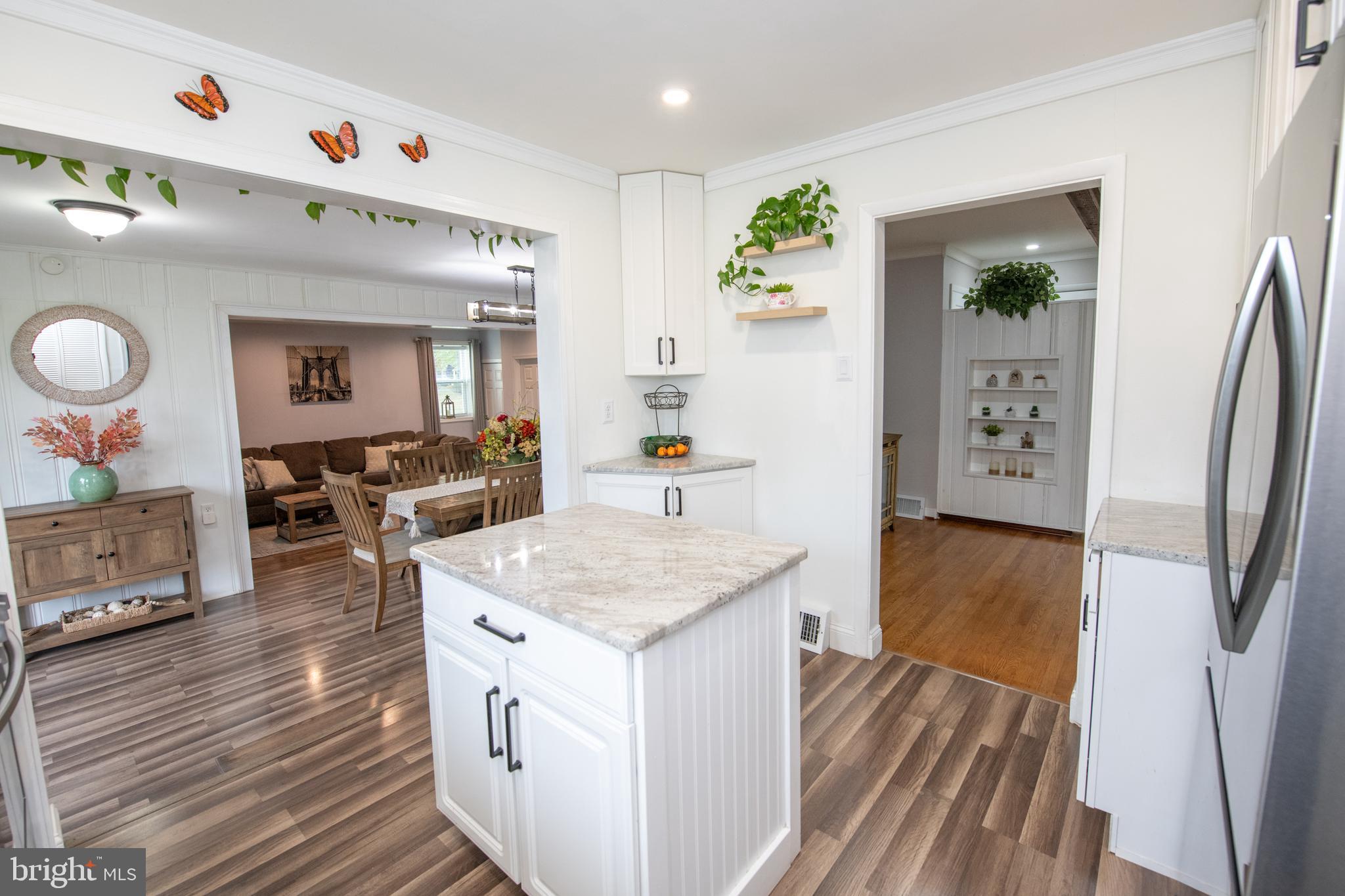 1309 Clyde Road Warminster, PA 18974 - Photo 14 of 39 a kitchen with stainless steel appliances granite countertop a lot of counter space and wooden floor