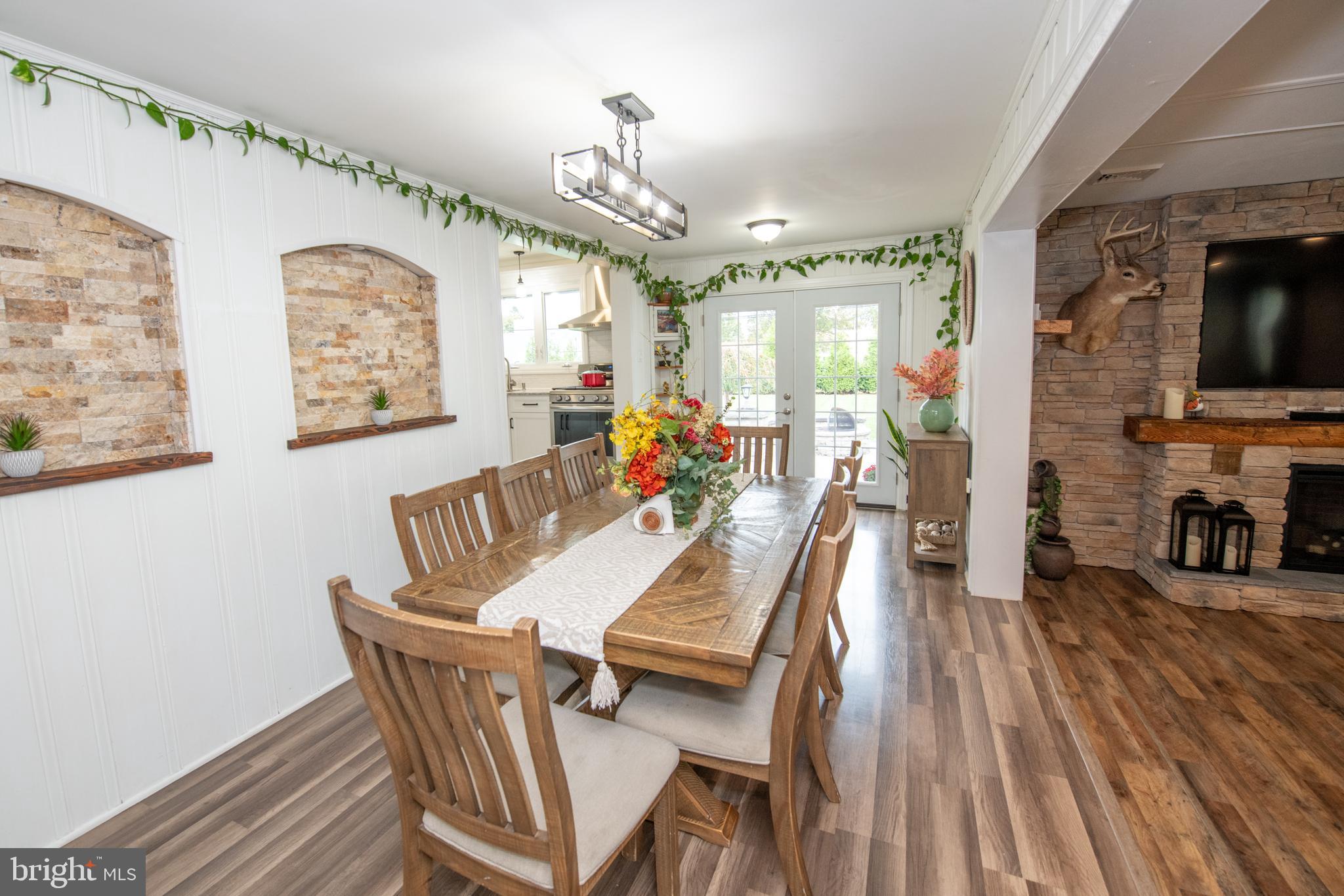 1309 Clyde Road Warminster, PA 18974 - Photo 16 of 39 a dining room with furniture a chandelier and wooden floor