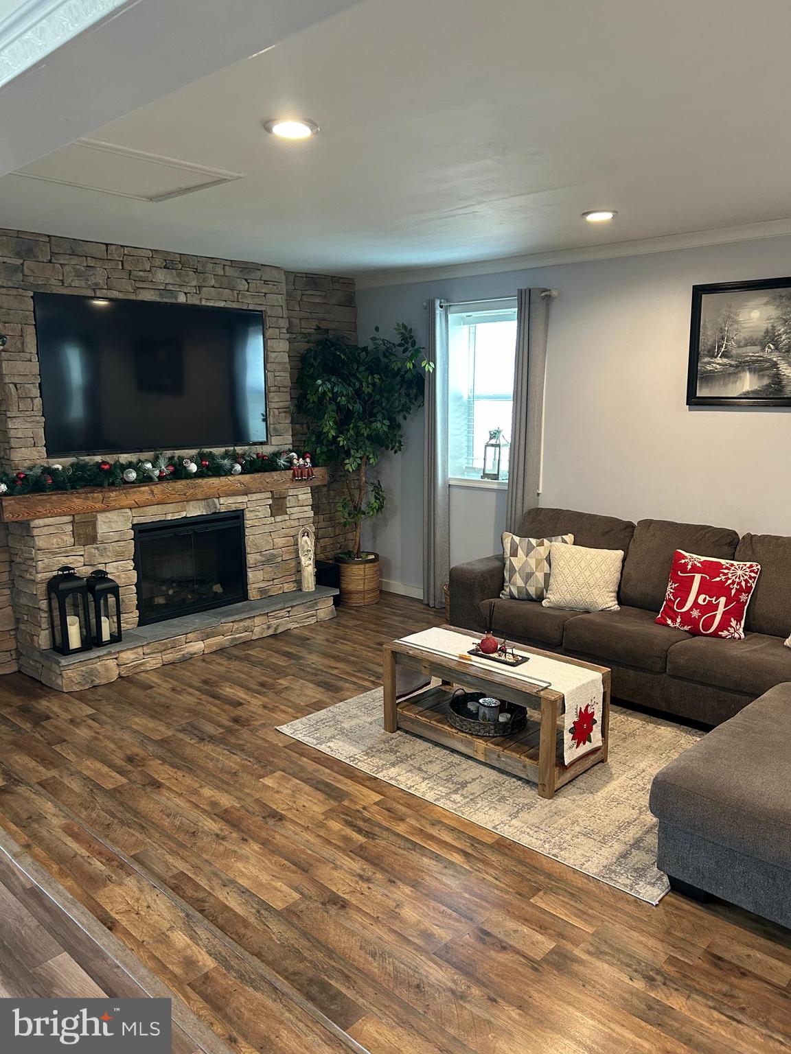 1309 Clyde Road Warminster, PA 18974 - Photo 18 of 39 a living room with furniture and a flat screen tv