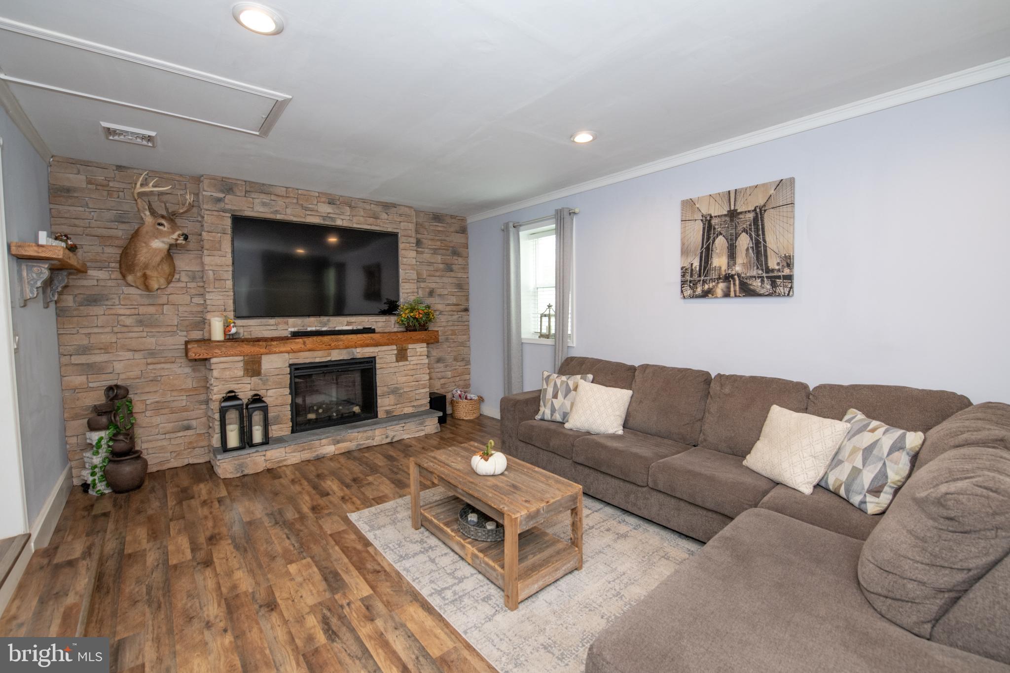 1309 Clyde Road Warminster, PA 18974 - Photo 19 of 39 a living room with furniture and a flat screen tv