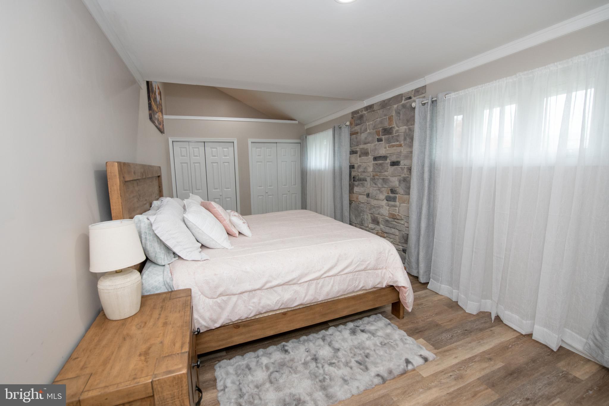 1309 Clyde Road Warminster, PA 18974 - Photo 29 of 39 a bedroom with a bed and a mirror