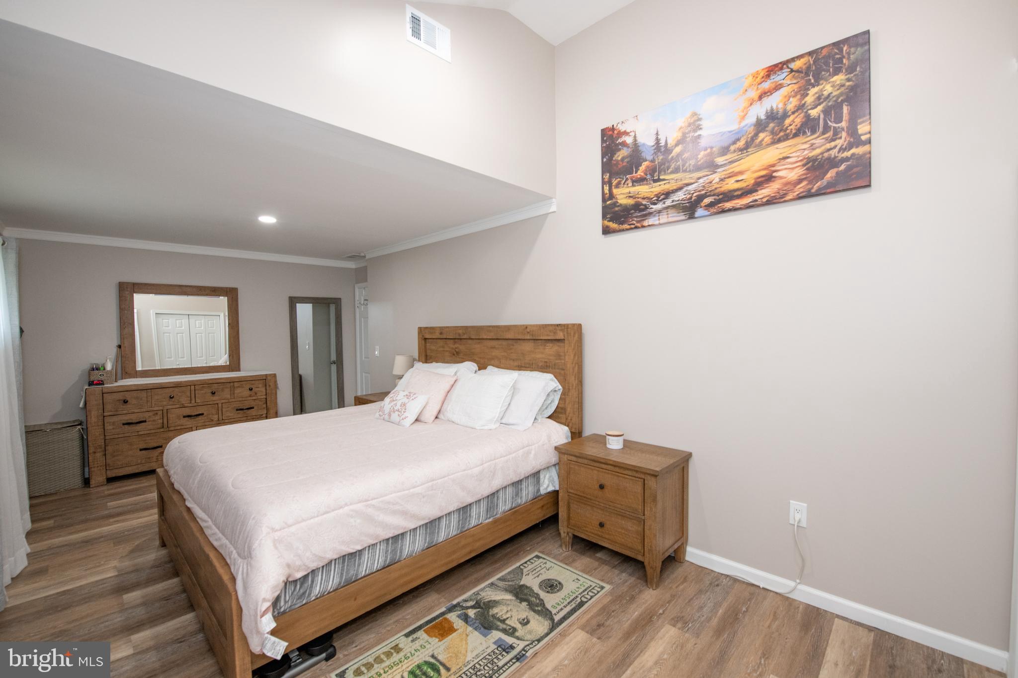 1309 Clyde Road Warminster, PA 18974 - Photo 30 of 39 a bedroom with a bed and wooden floor