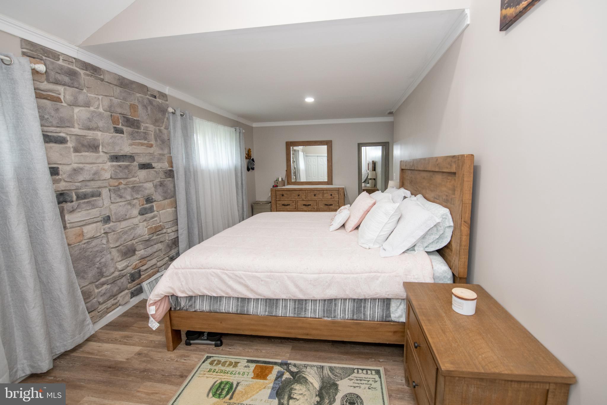 1309 Clyde Road Warminster, PA 18974 - Photo 31 of 39 a bedroom with a bed and a mirror