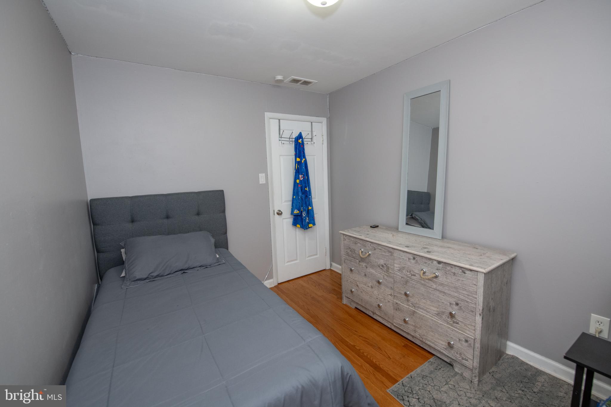 1309 Clyde Road Warminster, PA 18974 - Photo 32 of 39 a bedroom with a bed and a mirror