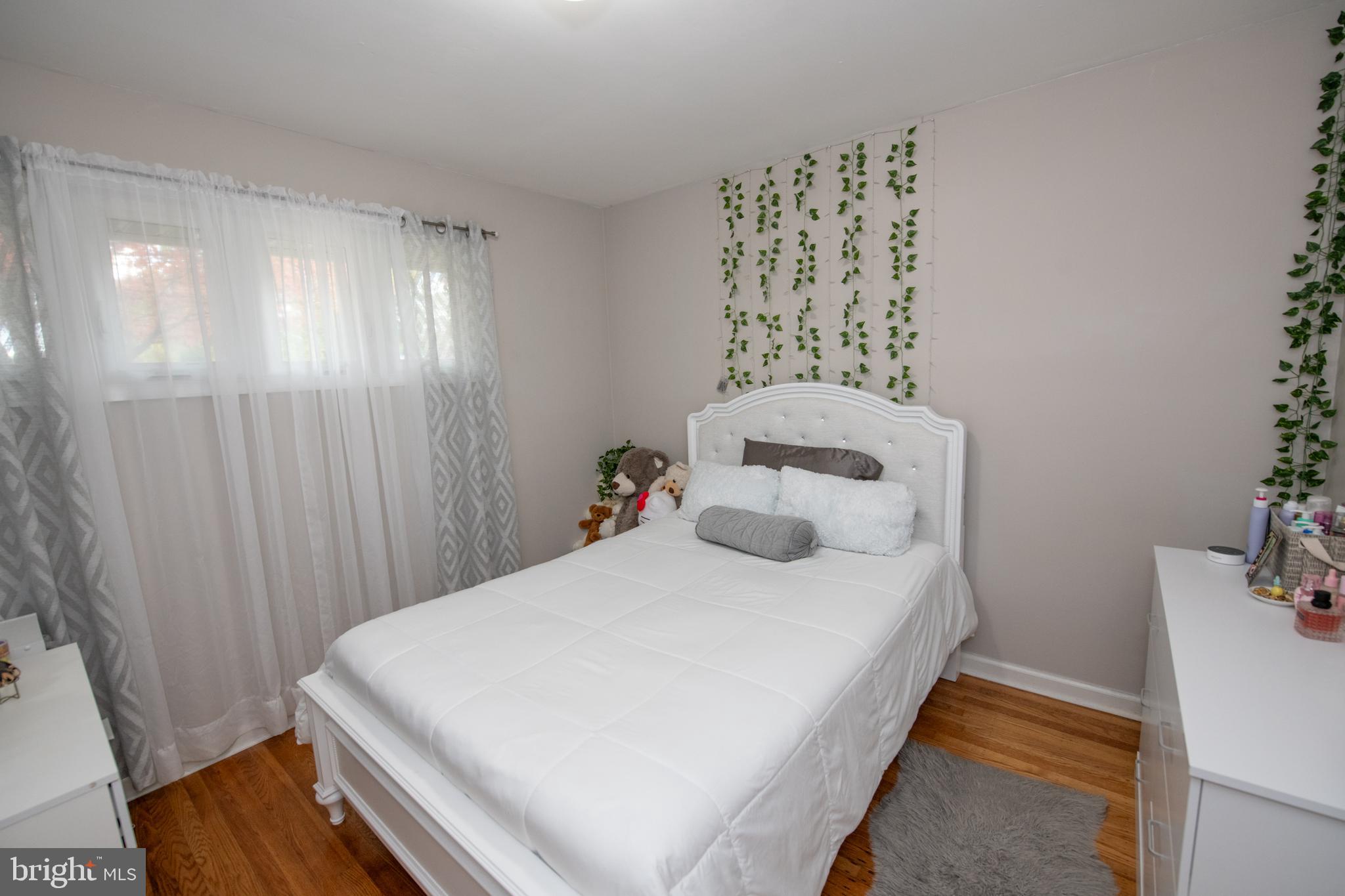 1309 Clyde Road Warminster, PA 18974 - Photo 37 of 39 a bedroom with a bed and a window