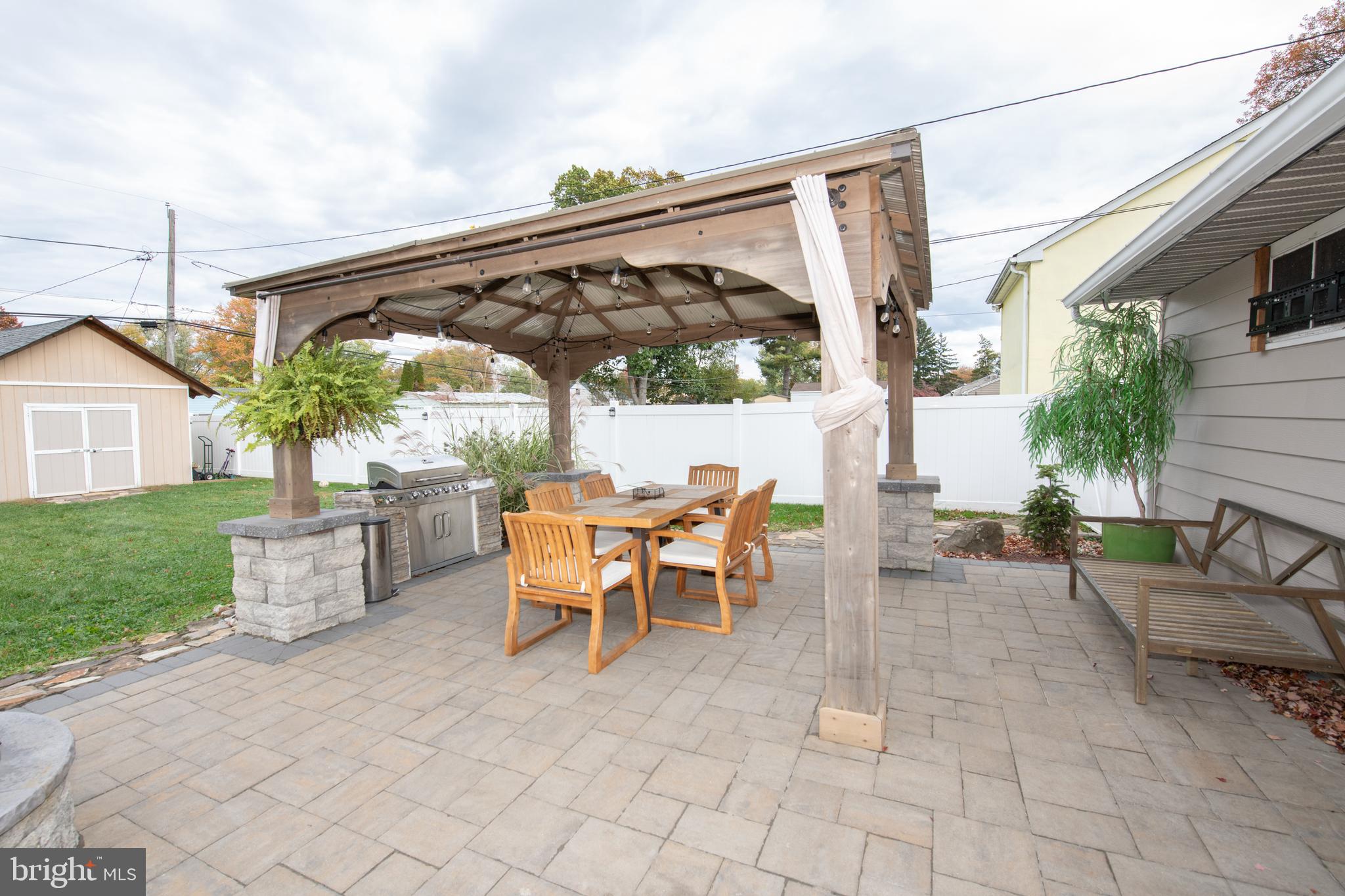 1309 Clyde Road Warminster, PA 18974 - Photo 4 of 39 a view of a patio with a table and chairs