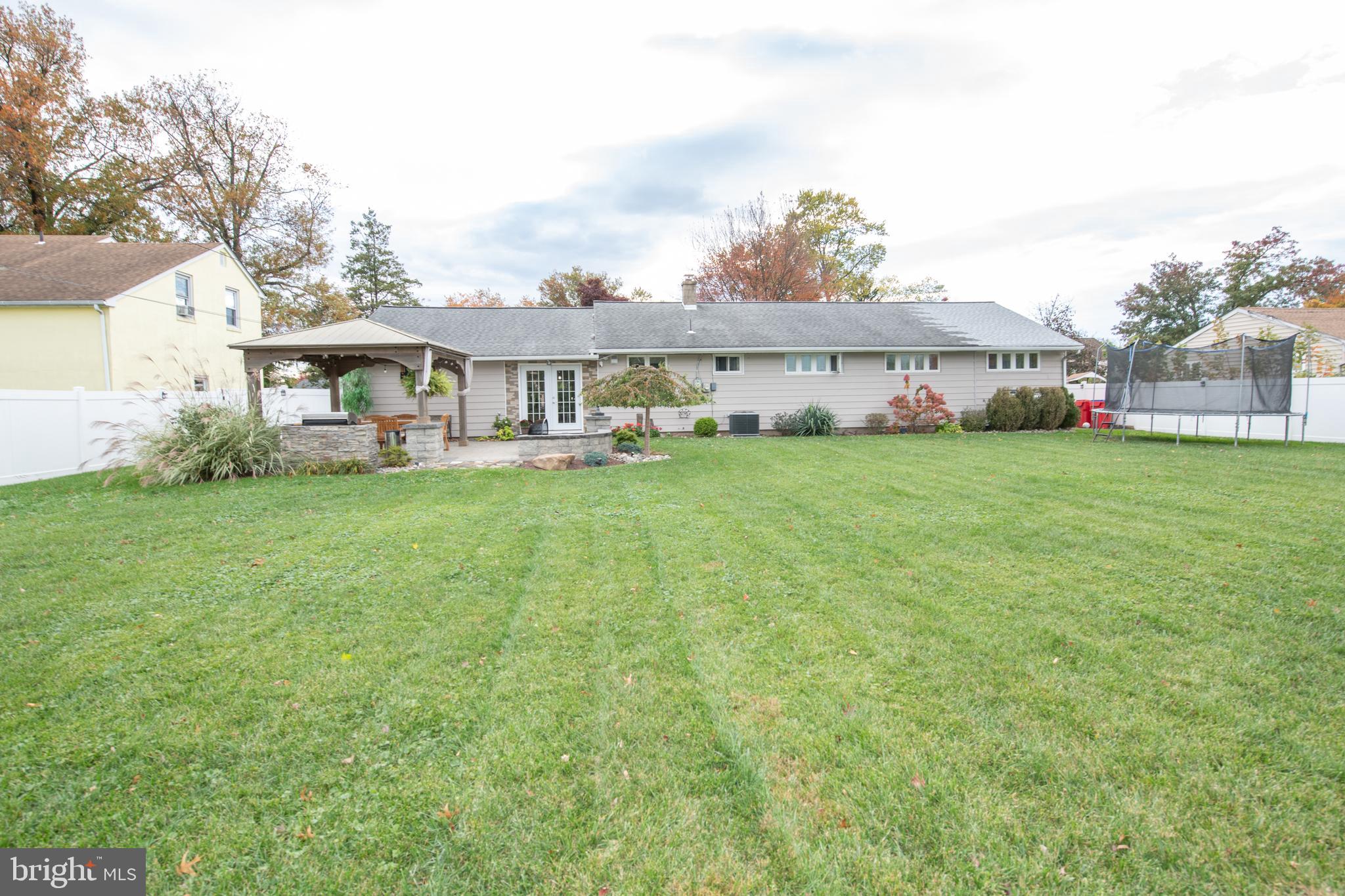 1309 Clyde Road Warminster, PA 18974 - Photo 6 of 39 a view of a house with a big yard and large trees