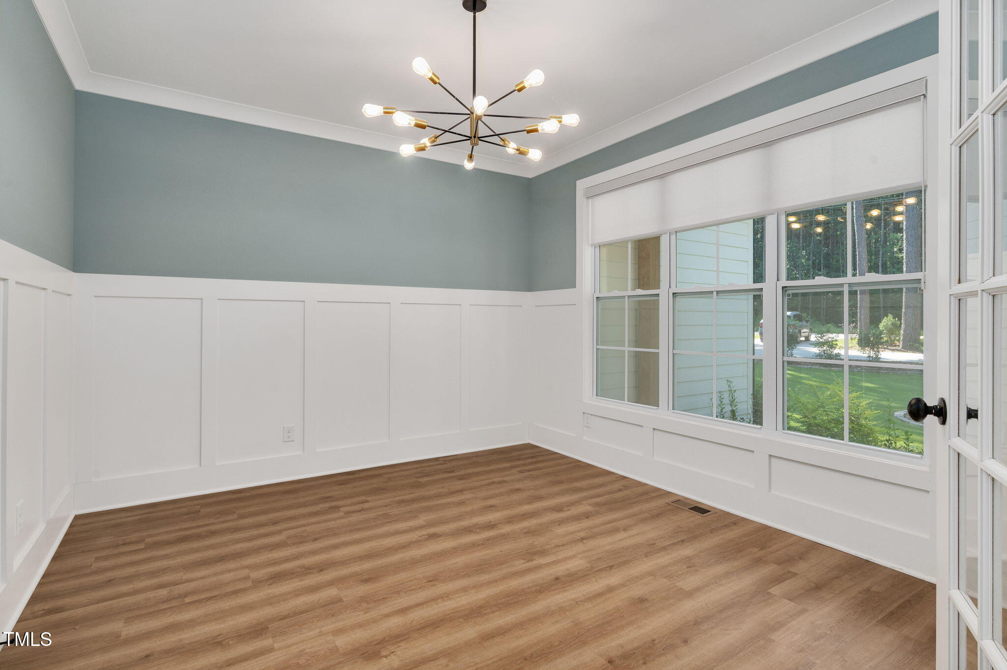 3511 Bruce Garner Road Wake Forest, NC 27587 - Photo 13 of 46 a view of empty room with wooden floor and fan