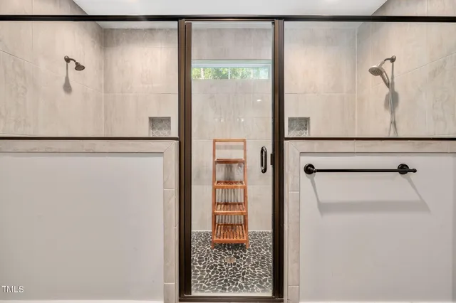 a view of bathroom with a refrigerator