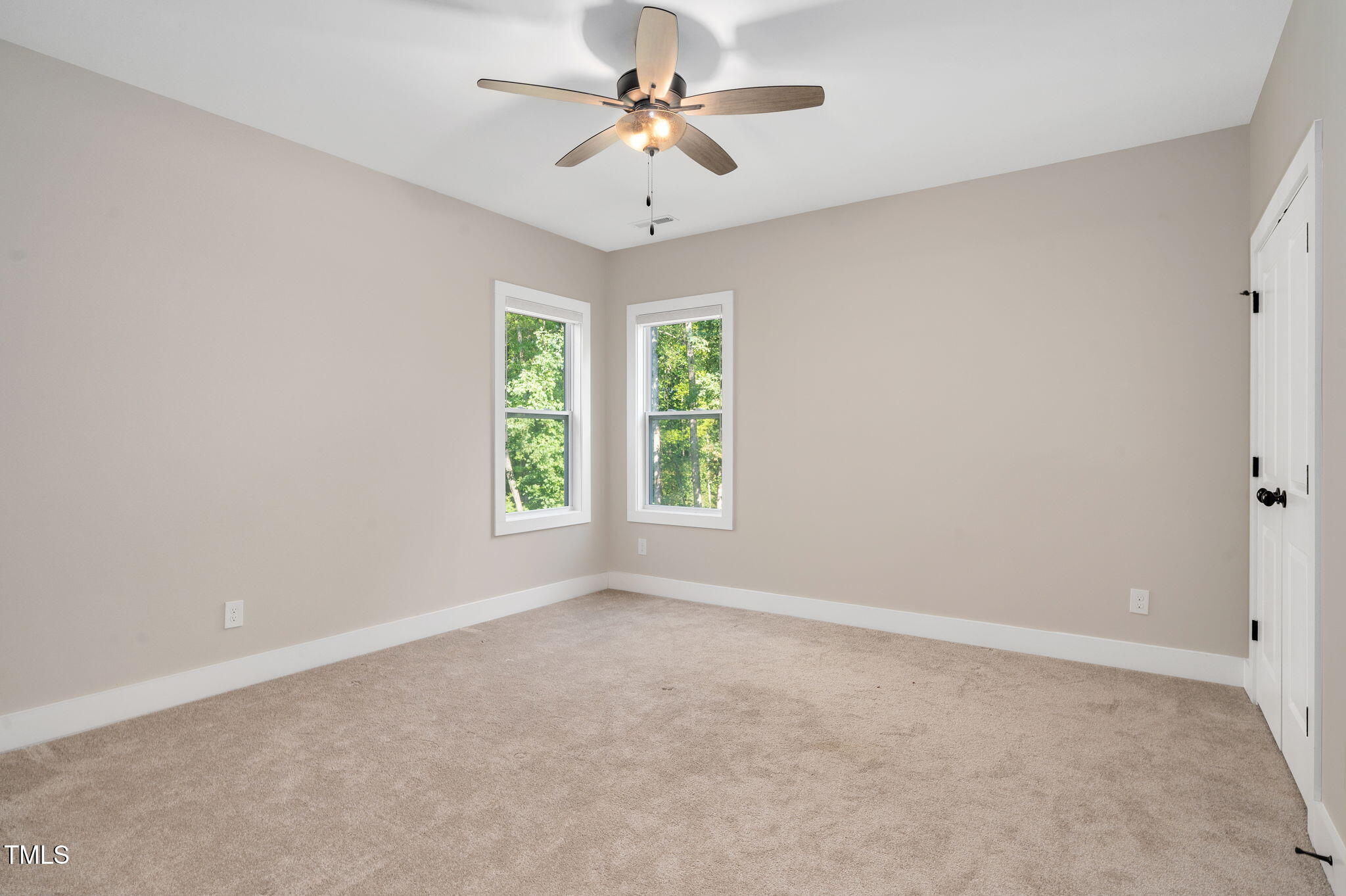 3511 Bruce Garner Road Wake Forest, NC 27587 - Photo 24 of 46 an empty room with windows and ceiling fan