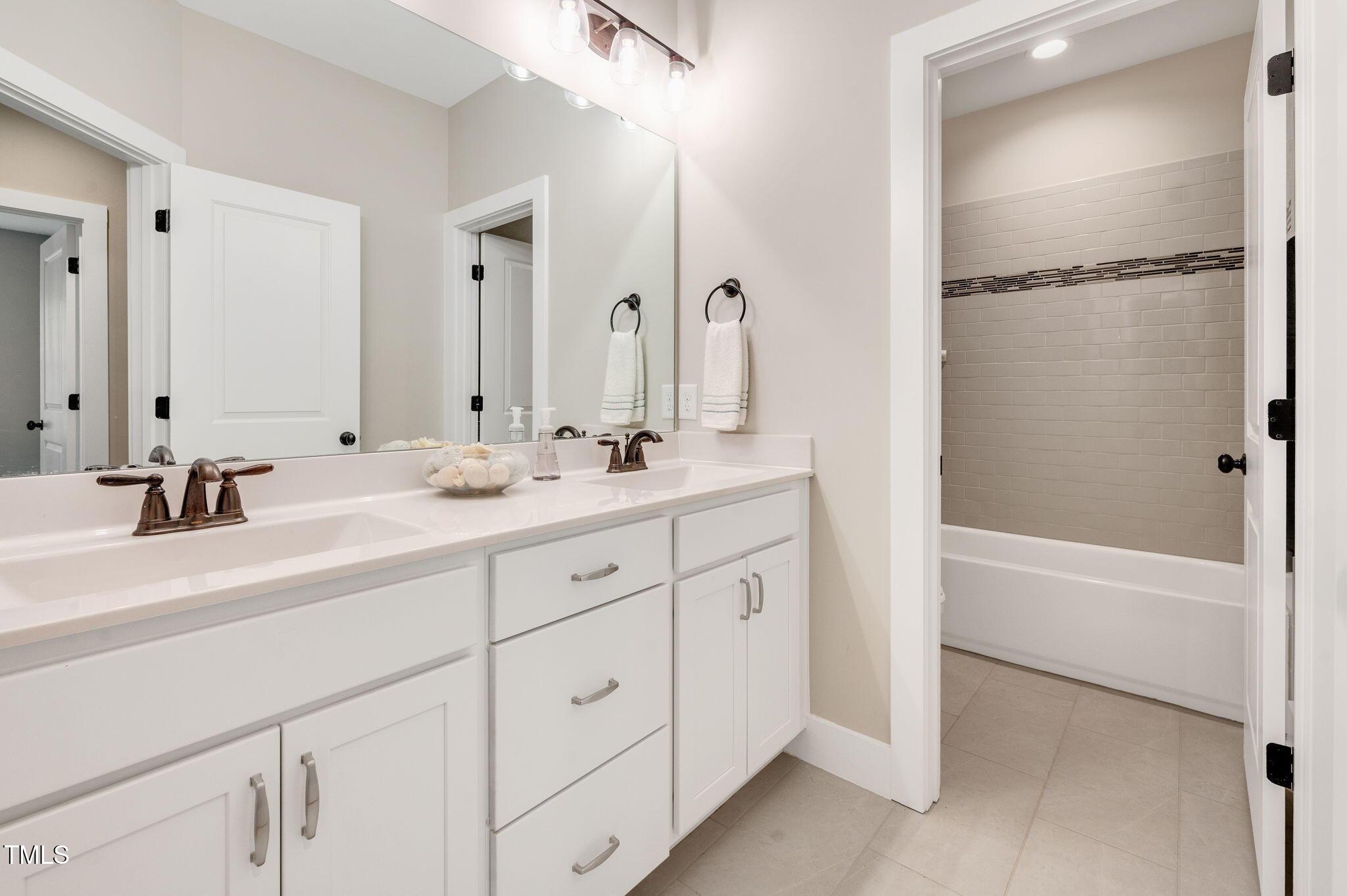 3511 Bruce Garner Road Wake Forest, NC 27587 - Photo 27 of 46 a bathroom with a double vanity sink mirror and double