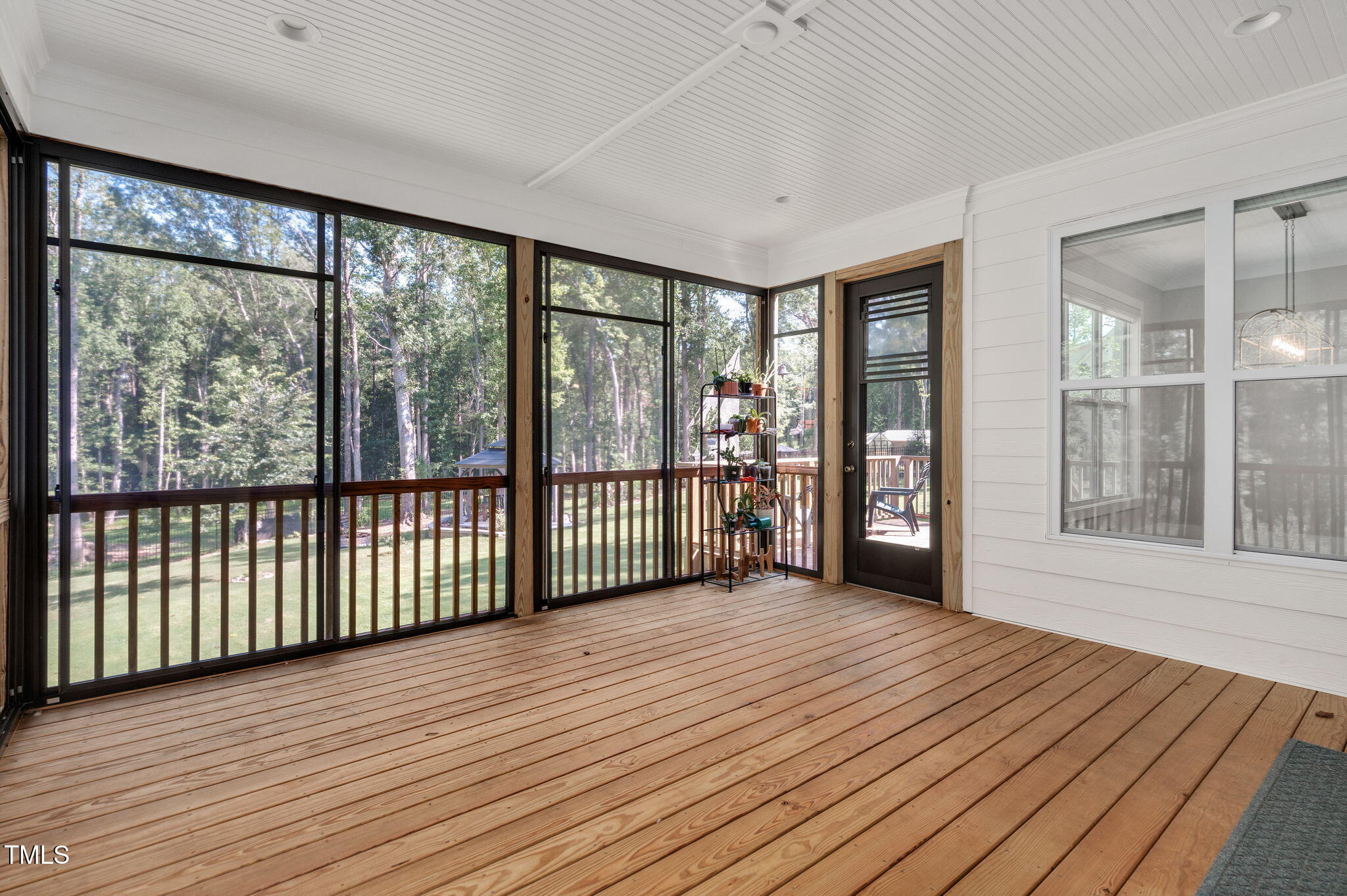 3511 Bruce Garner Road Wake Forest, NC 27587 - Photo 32 of 46 a view of a room with wooden floor and large windows