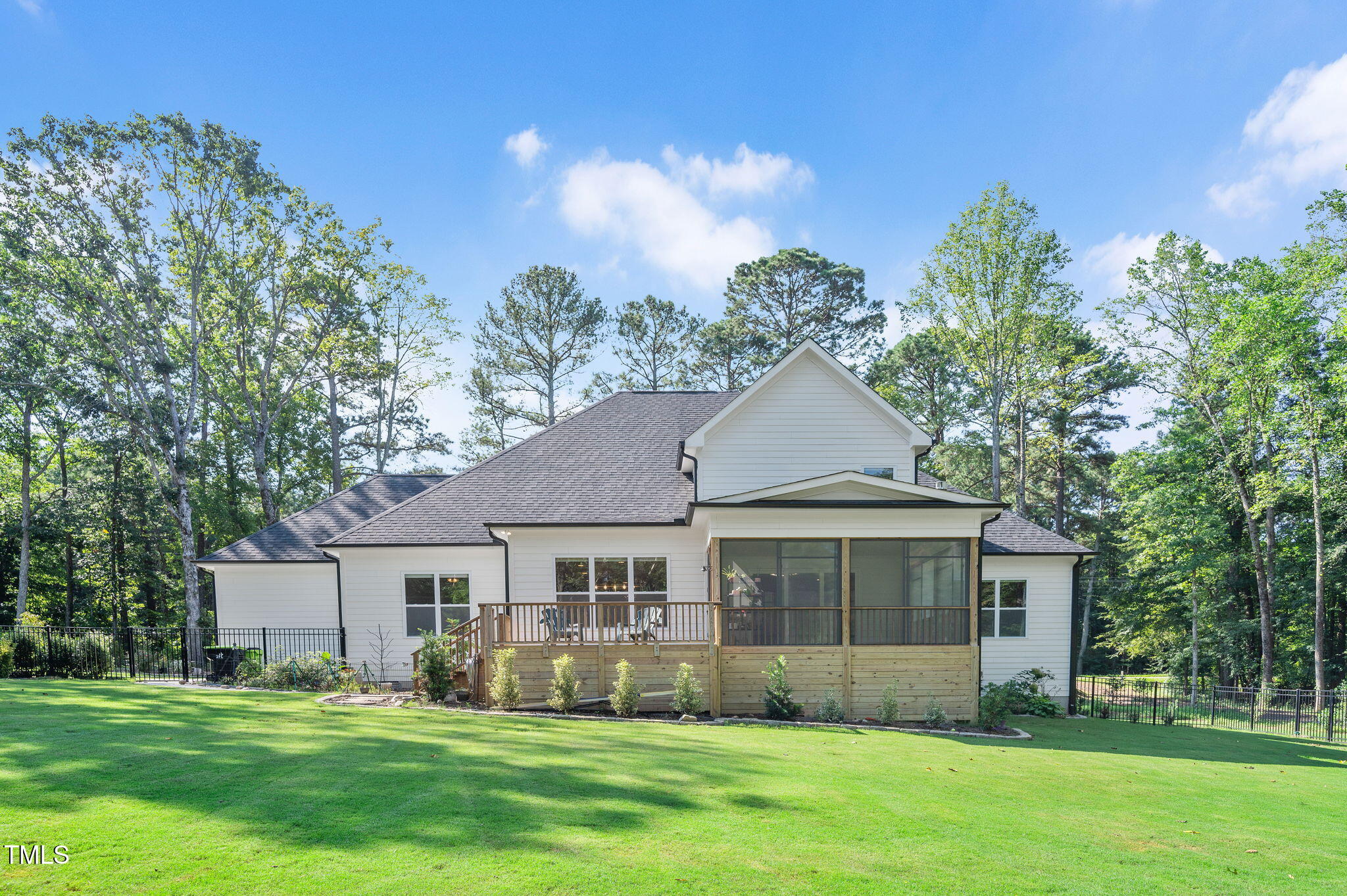 3511 Bruce Garner Road Wake Forest, NC 27587 - Photo 34 of 46 a front view of a house with a garden and trees