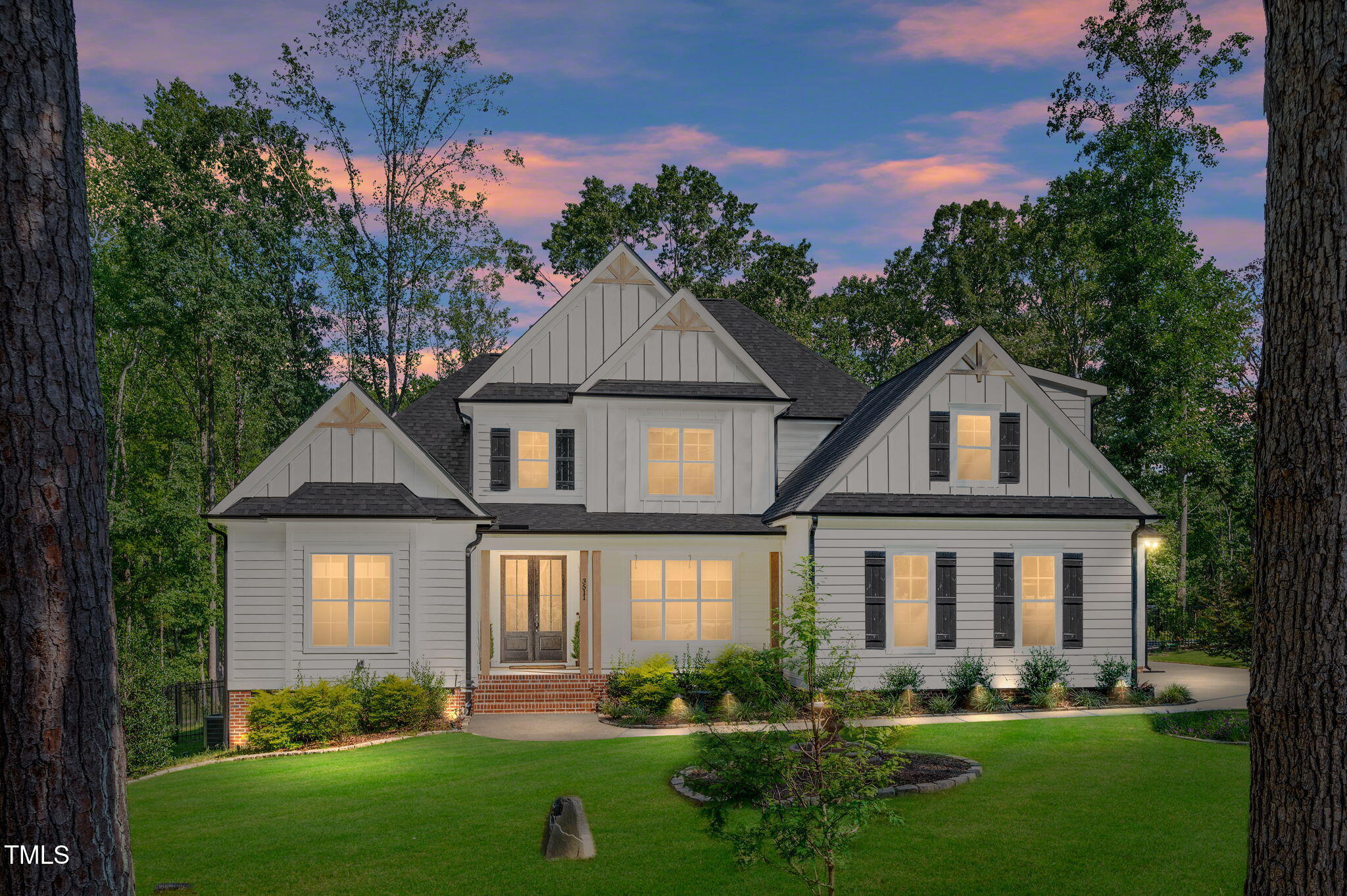 3511 Bruce Garner Road Wake Forest, NC 27587 - Photo 38 of 46 a front view of a house with a yard and potted plants