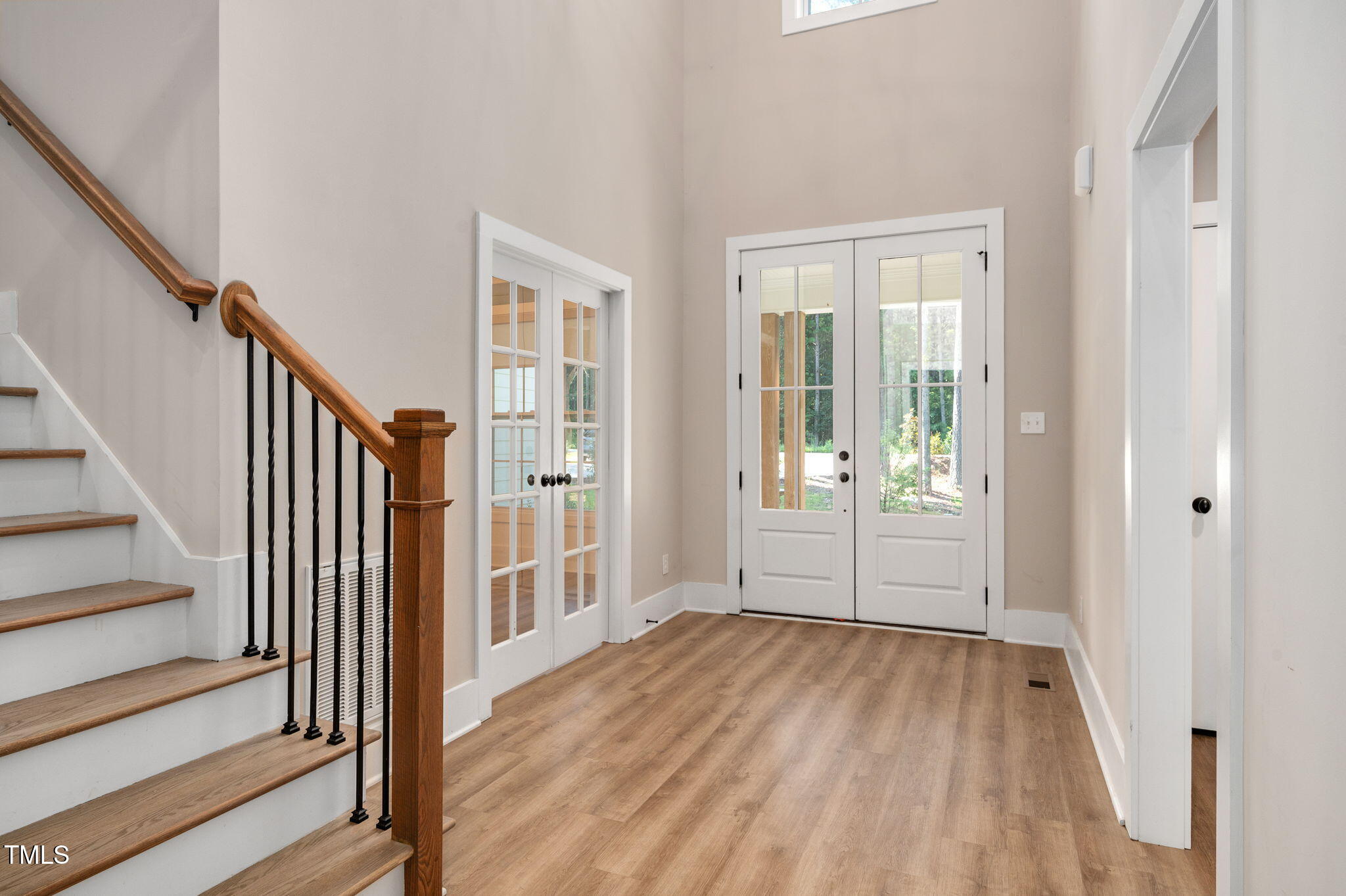 3511 Bruce Garner Road Wake Forest, NC 27587 - Photo 4 of 46 a view of an entryway with wooden floor and door