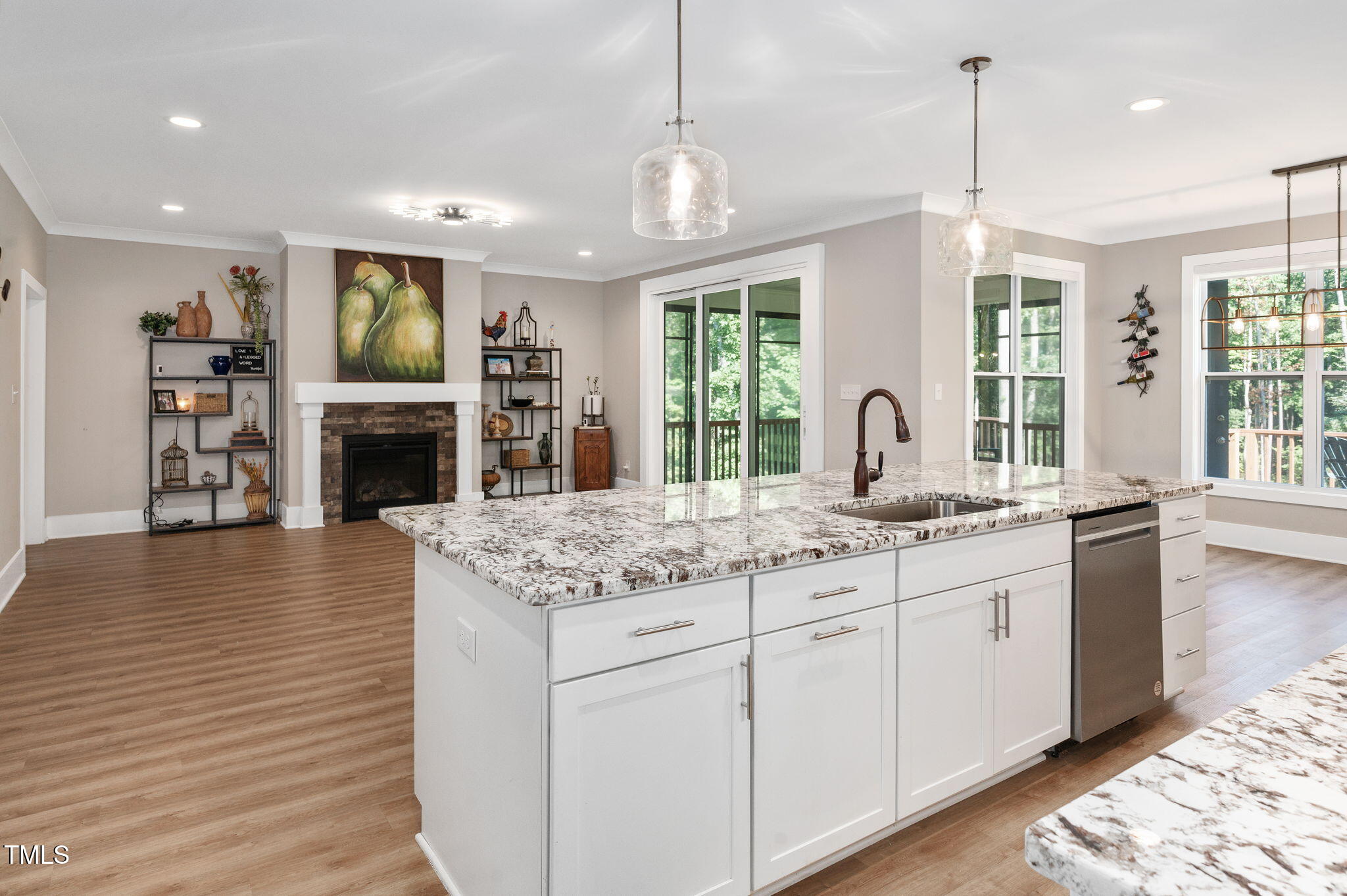 3511 Bruce Garner Road Wake Forest, NC 27587 - Photo 43 of 46 a kitchen with stainless steel appliances granite countertop sink stove refrigerator and couches