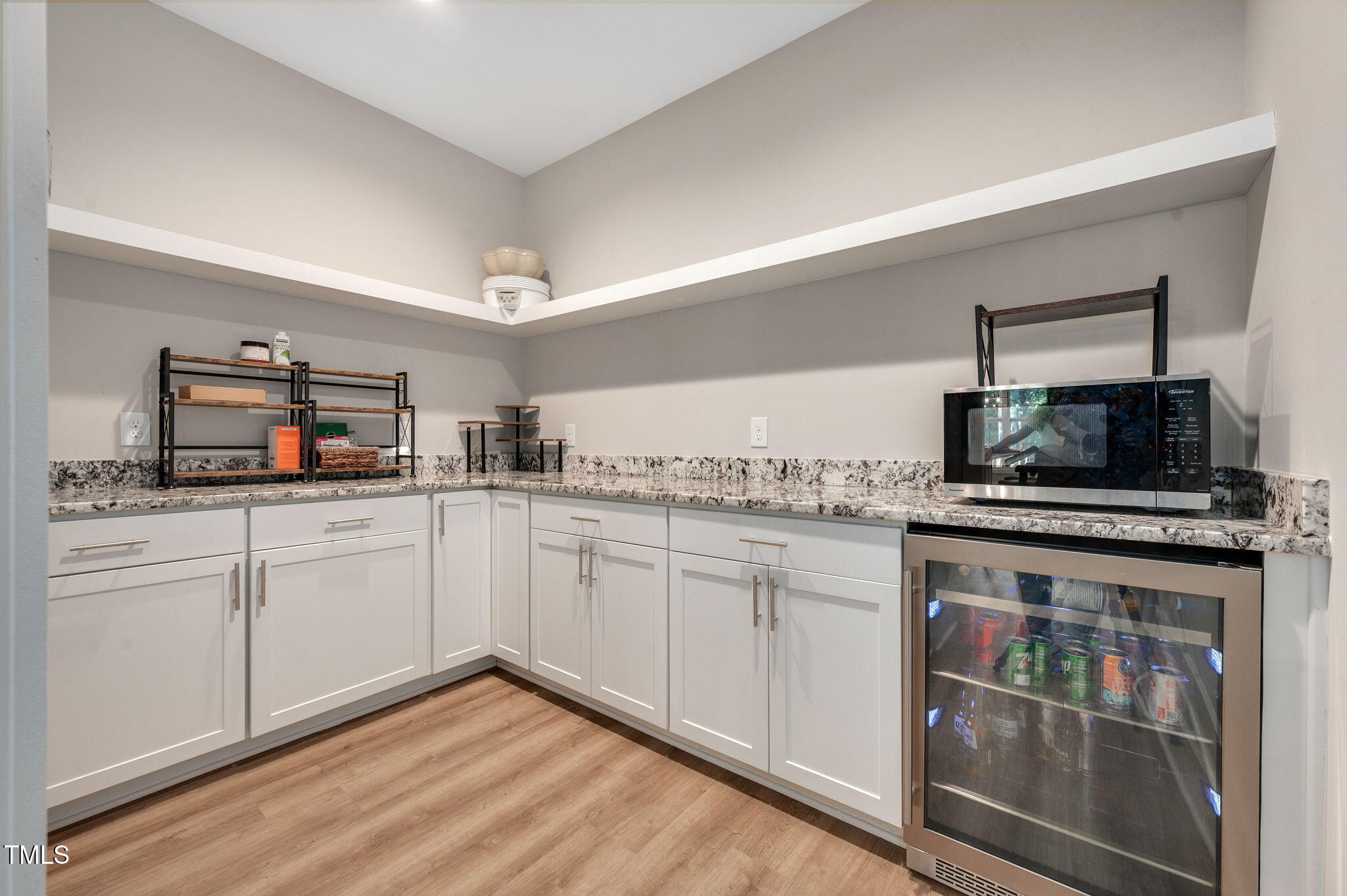 3511 Bruce Garner Road Wake Forest, NC 27587 - Photo 8 of 46 a kitchen with stainless steel appliances granite countertop a stove a sink and a microwave