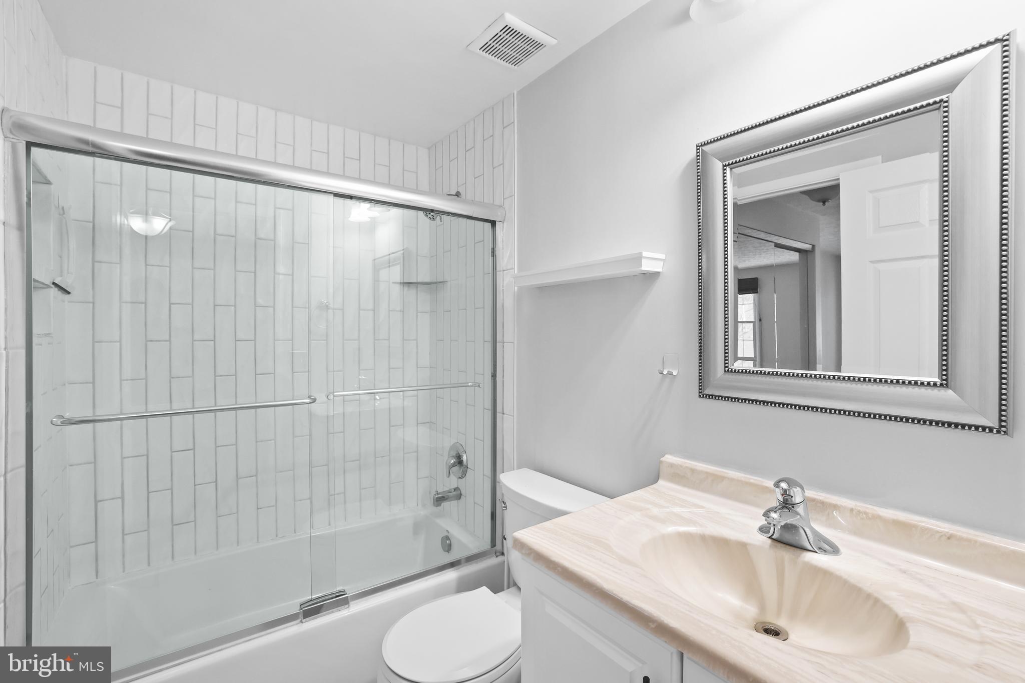 2858 New Providence Court Falls Church, VA 22042 - Photo 15 of 62 a bathroom with a sink and a mirror