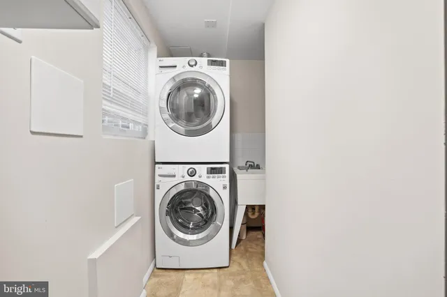 a view of a patio with couches table and chairs and potted plants