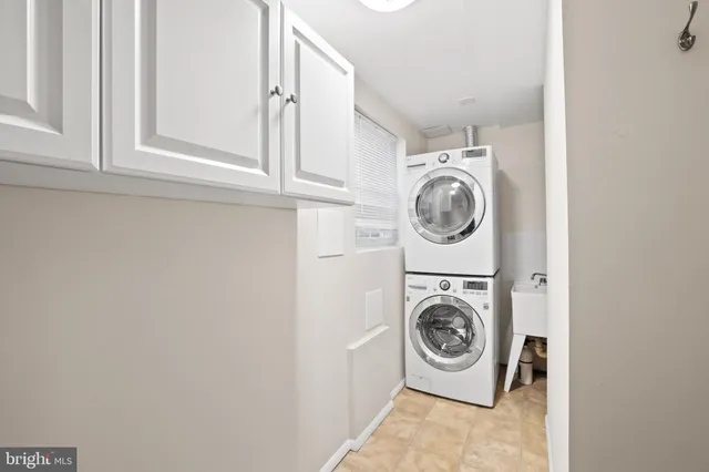 a view of a house with wooden fence