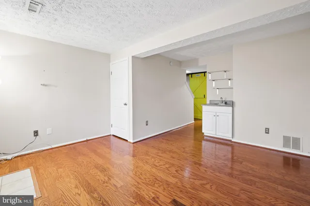 a view of a street with a building in the background