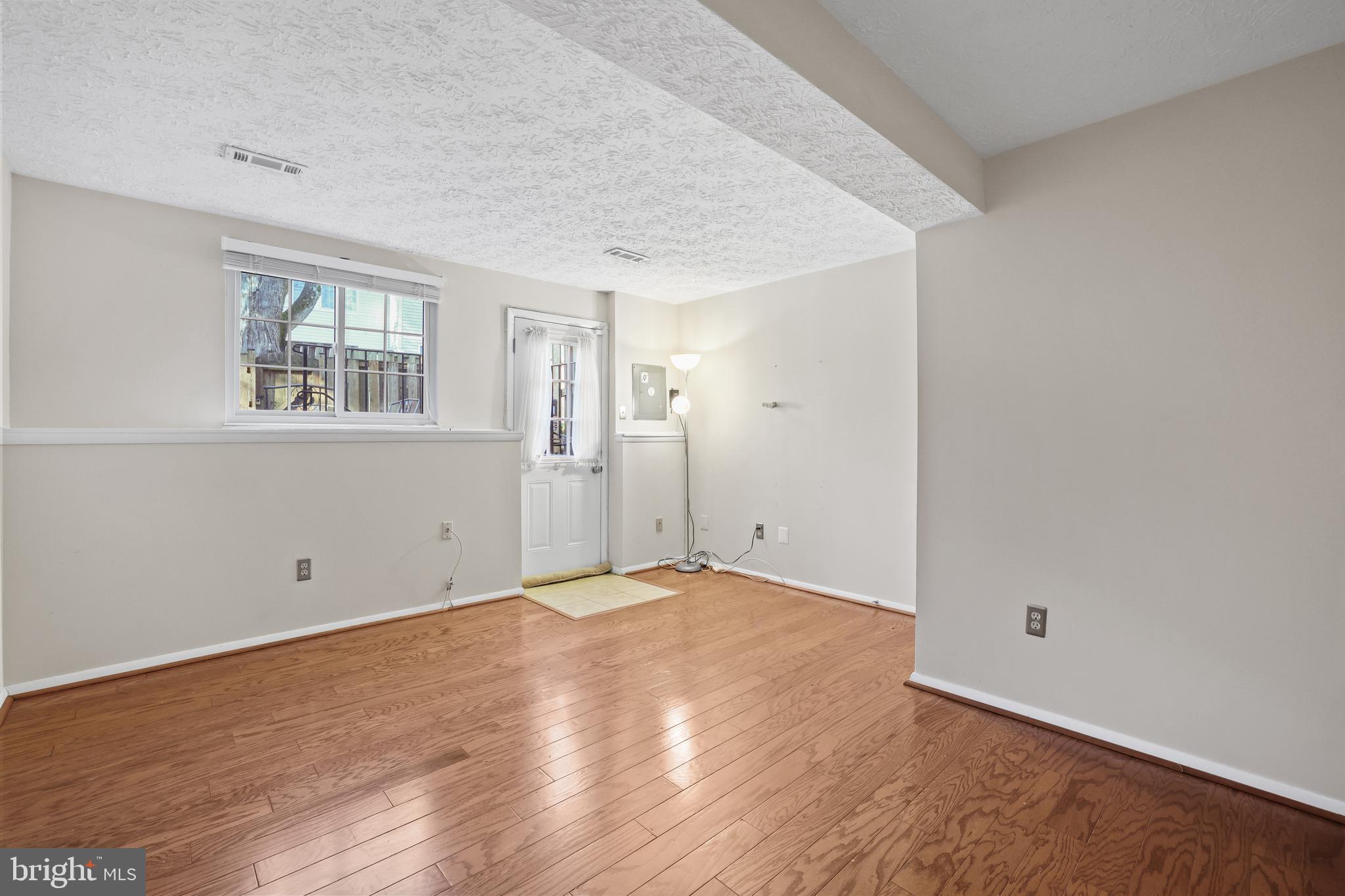 2858 New Providence Court Falls Church, VA 22042 - Photo 28 of 62 an empty room with wooden floor and windows
