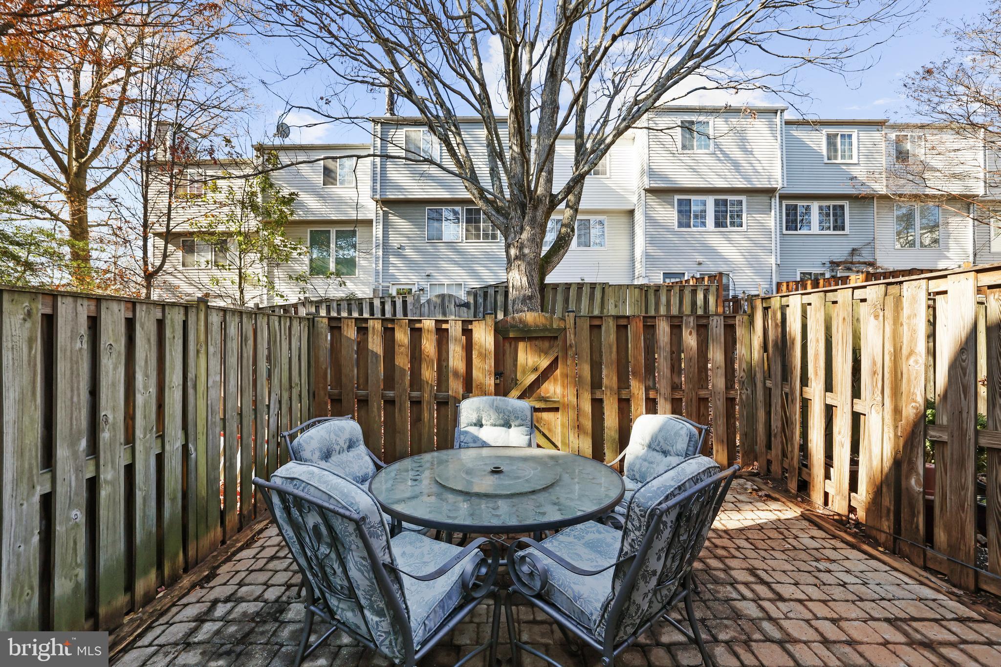 2858 New Providence Court Falls Church, VA 22042 - Photo 29 of 62 a backyard of a house with table and chairs