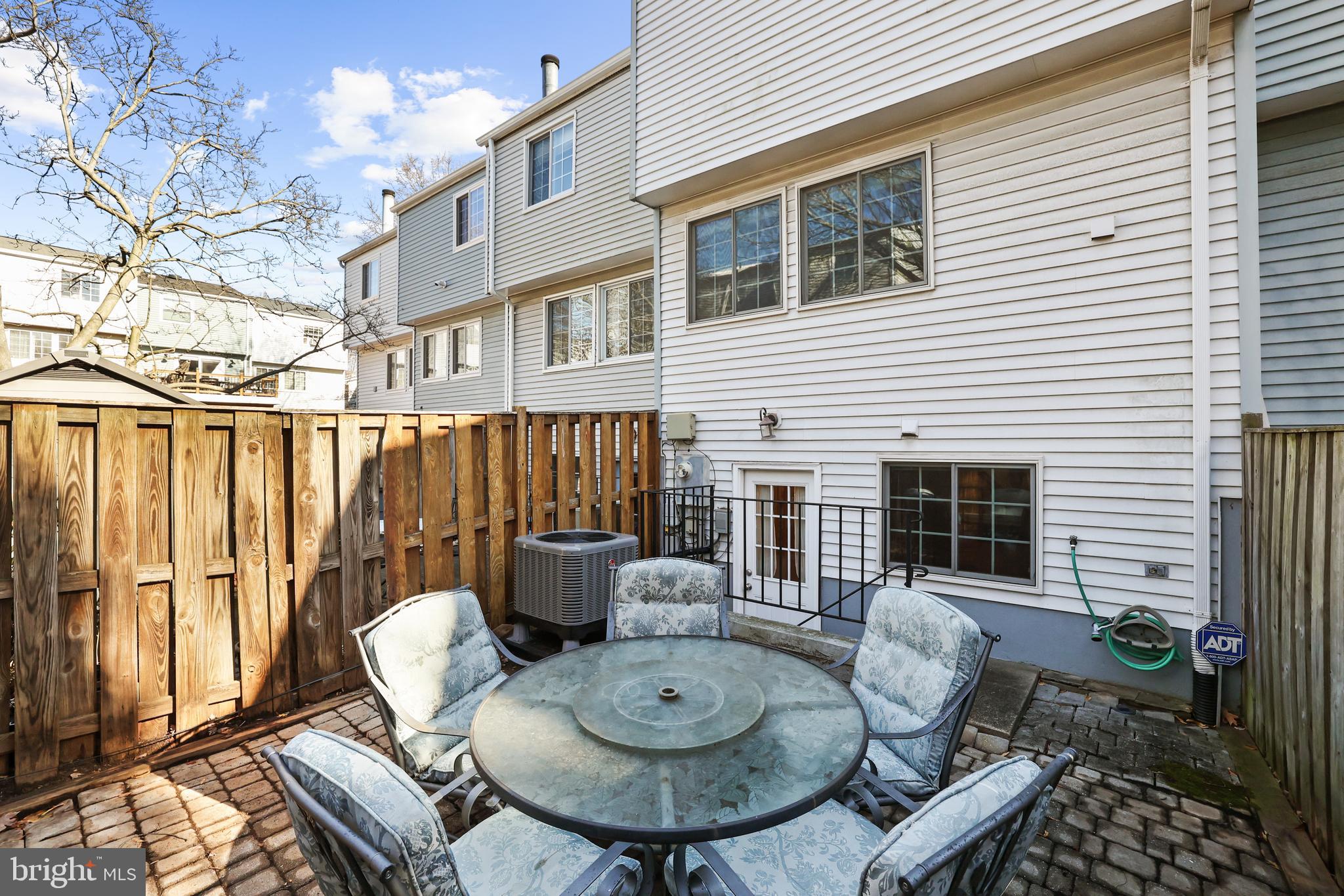 2858 New Providence Court Falls Church, VA 22042 - Photo 30 of 62 a view of a patio with couches table and chairs and potted plants