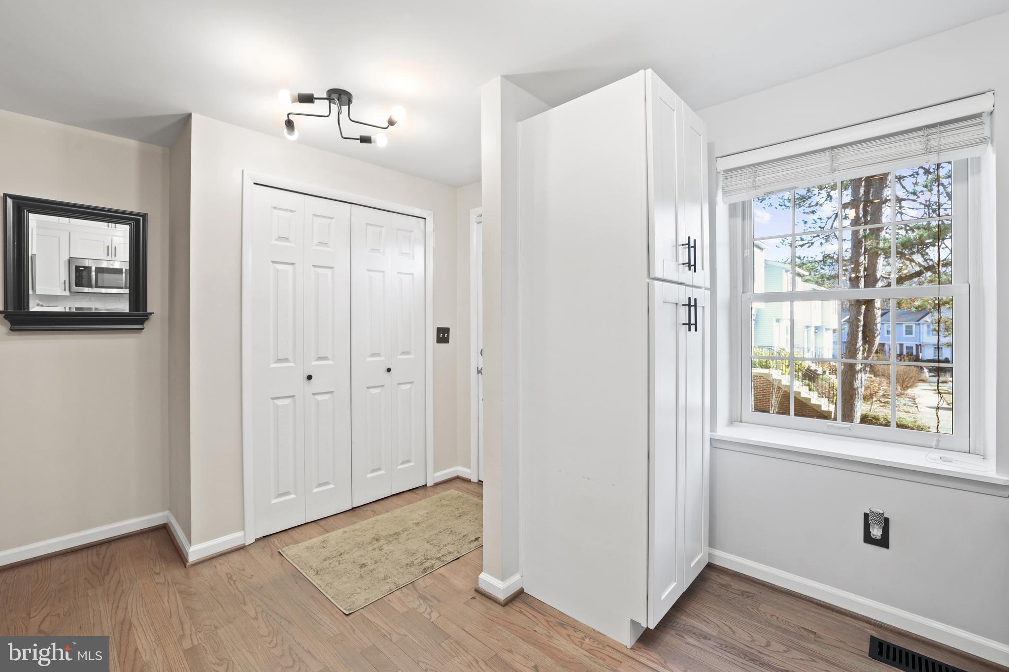 2858 New Providence Court Falls Church, VA 22042 - Photo 6 of 62 a view of an entryway with wooden floor and a cabinet
