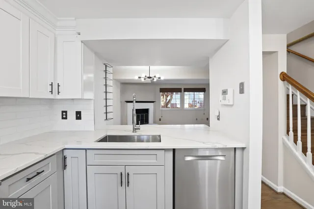 a kitchen with a stove sink and refrigerator