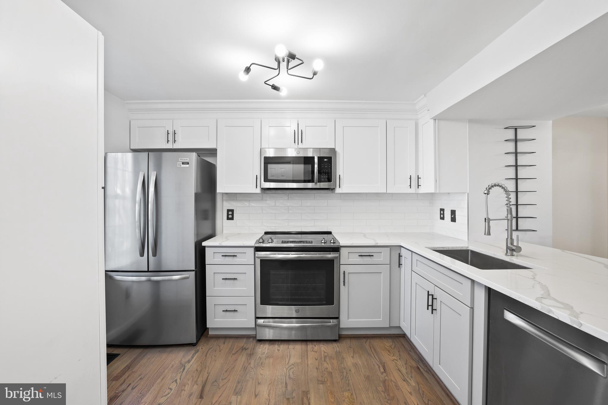 2858 New Providence Court Falls Church, VA 22042 - Photo 8 of 62 a kitchen with a stove sink and refrigerator