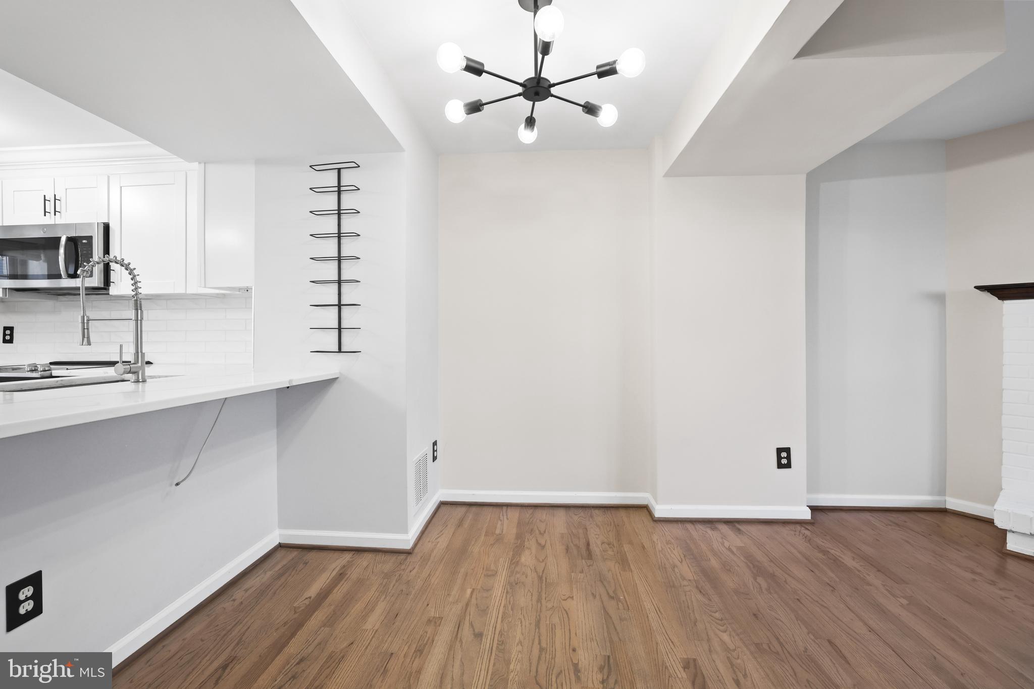 2858 New Providence Court Falls Church, VA 22042 - Photo 10 of 62 a view of a kitchen with wooden floor and a sink