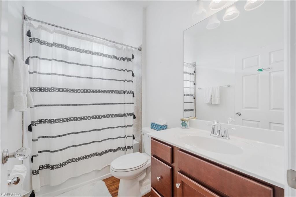 9052 Glenforest Drive Naples, FL 34120 - Photo 11 of 20 a bathroom with a sink toilet and shower