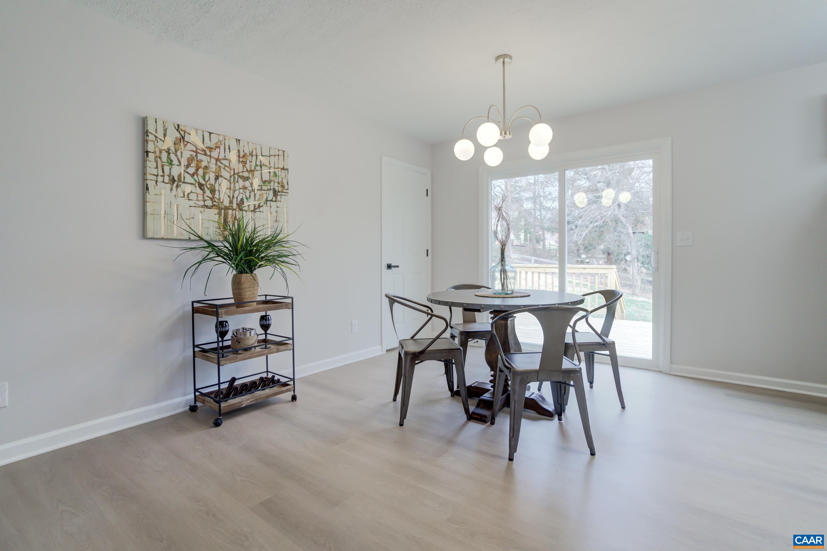 5582 Brookwood Road Crozet, VA 22932 - Photo 12 of 61 a view of a dining room with furniture window and outside view