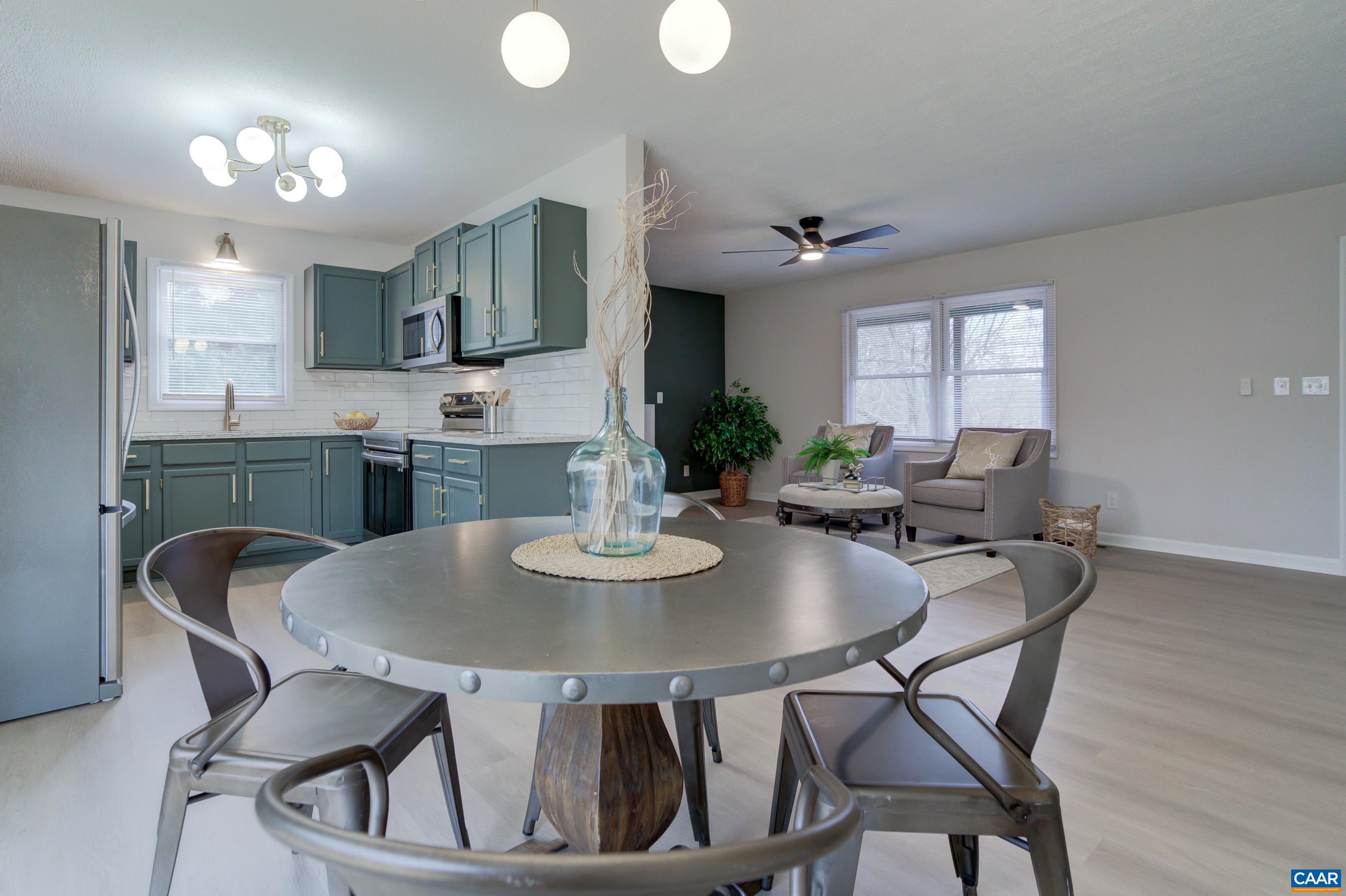 5582 Brookwood Road Crozet, VA 22932 - Photo 13 of 61 a view of a dining room with furniture and wooden floor