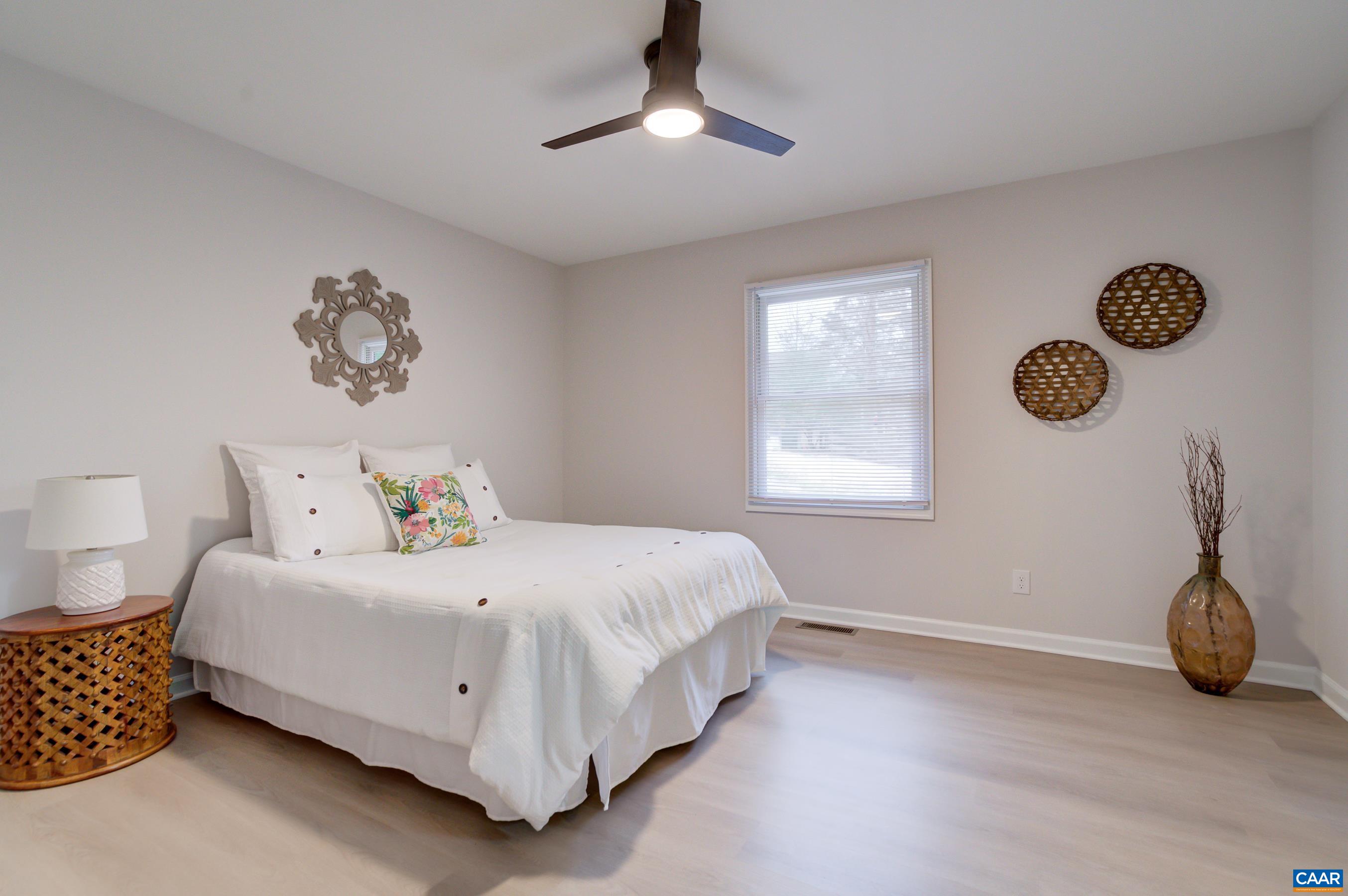 5582 Brookwood Road Crozet, VA 22932 - Photo 18 of 61 a bedroom with a bed and a window