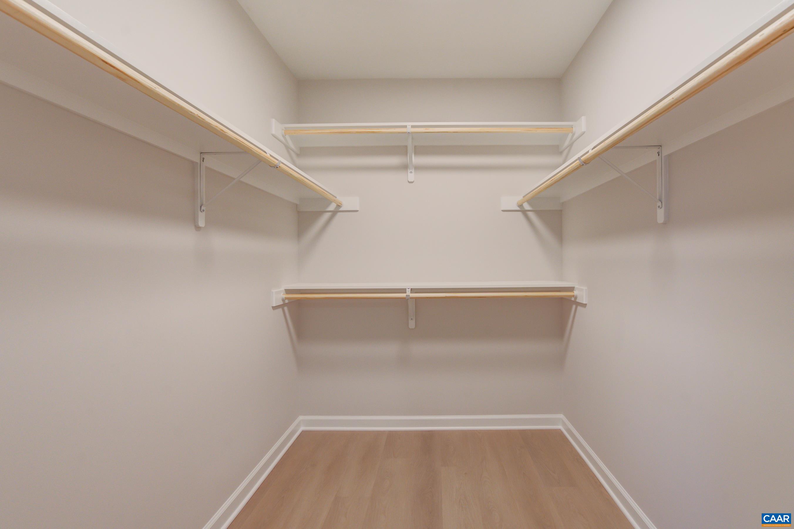 5582 Brookwood Road Crozet, VA 22932 - Photo 22 of 61 a view of walk in closet with empty racks