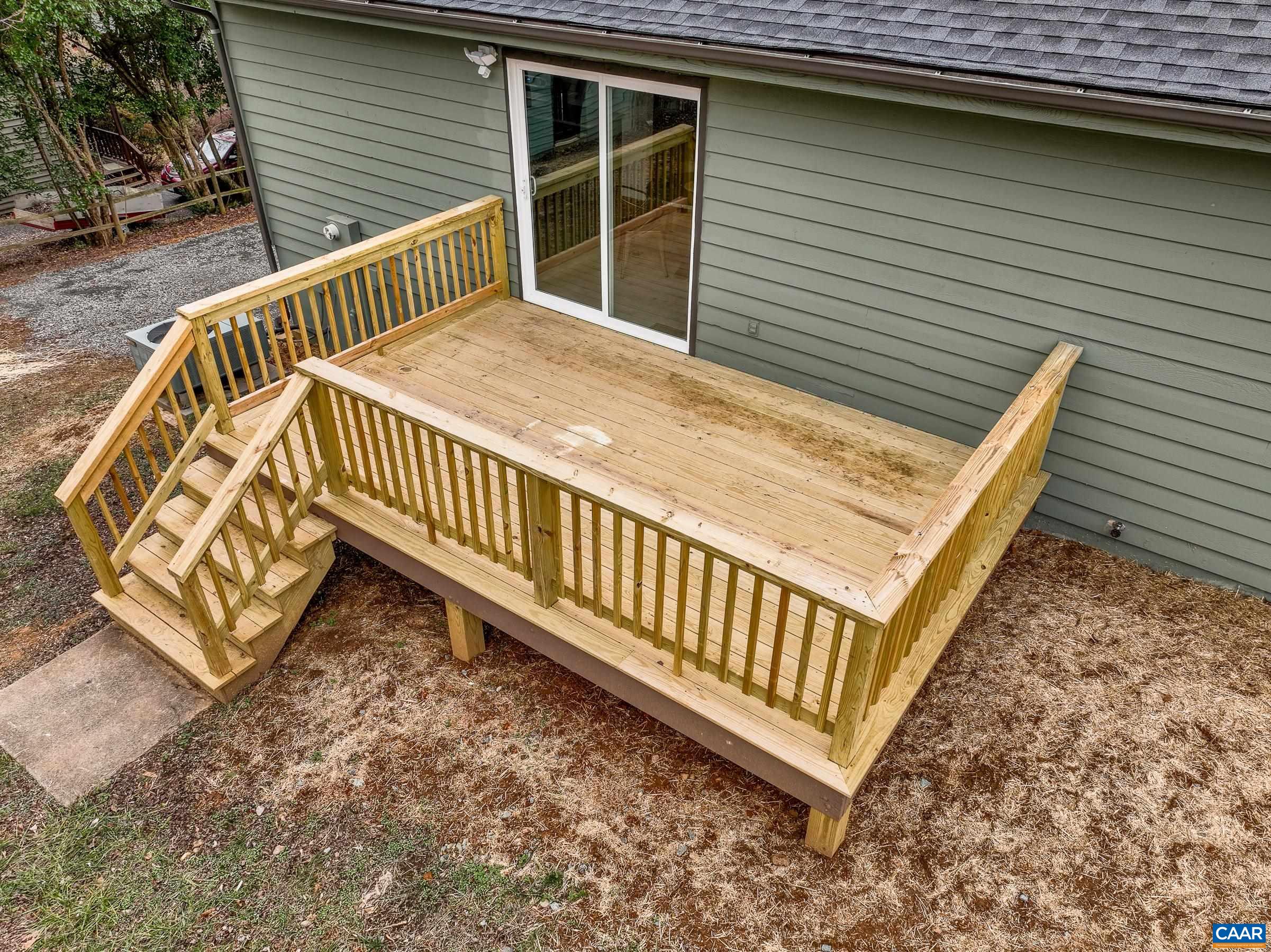 5582 Brookwood Road Crozet, VA 22932 - Photo 3 of 61 a view of a wooden deck with two chairs