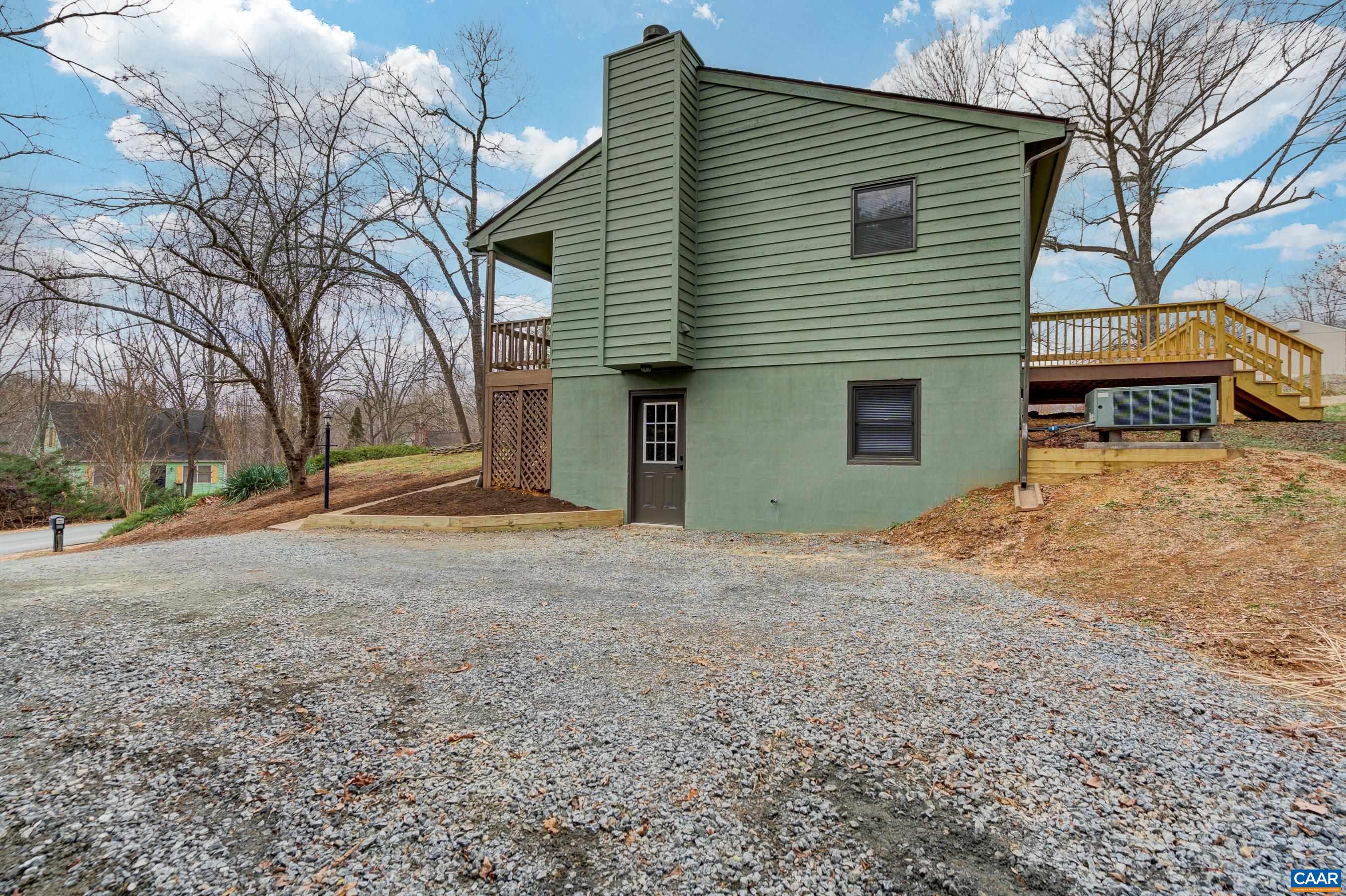 5582 Brookwood Road Crozet, VA 22932 - Photo 45 of 61 a view of a house with a yard and garage