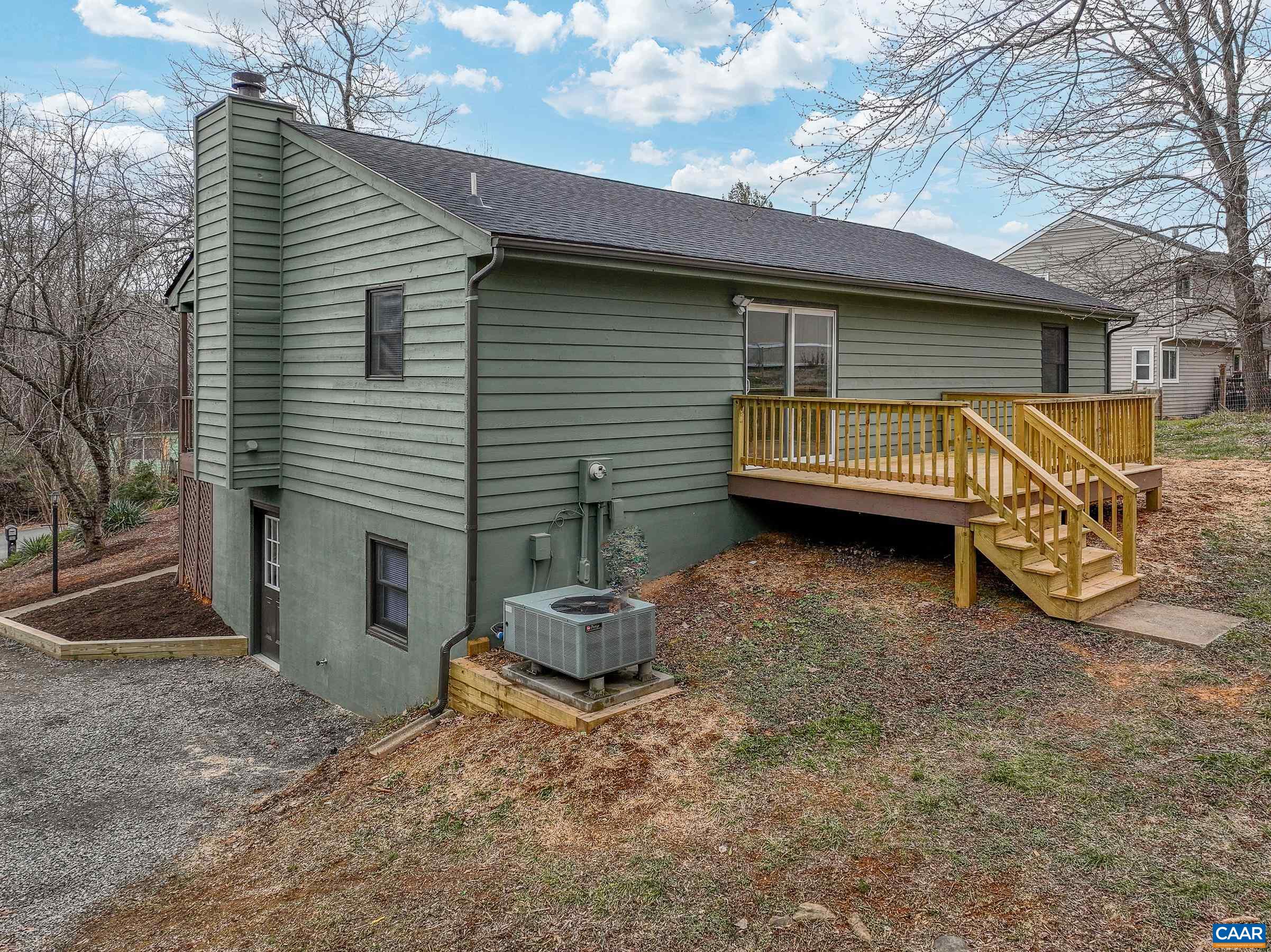 5582 Brookwood Road Crozet, VA 22932 - Photo 57 of 61 a view of a house with a yard and a fire pit