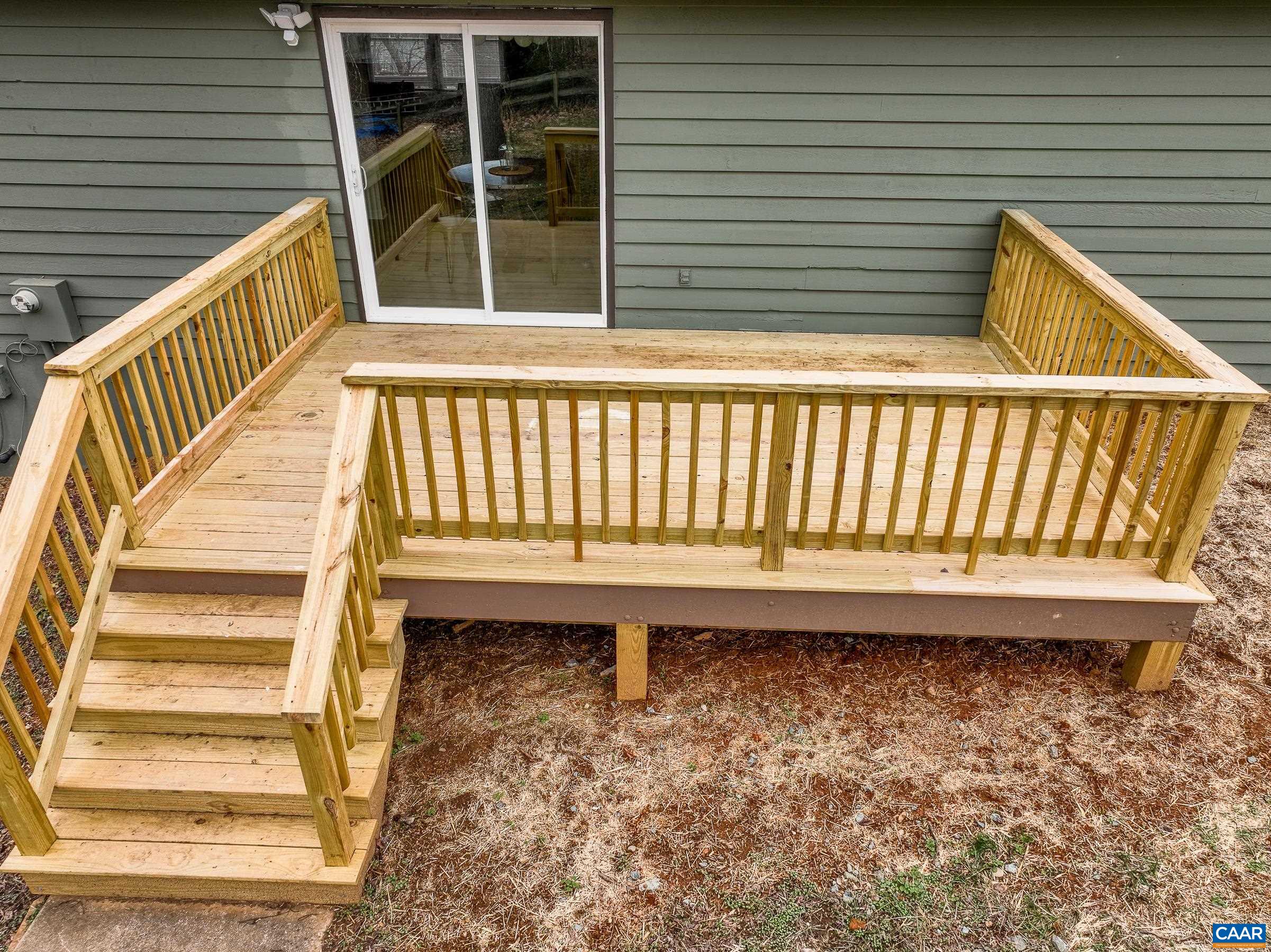5582 Brookwood Road Crozet, VA 22932 - Photo 60 of 61 a view of a balcony with a chair and wooden floor